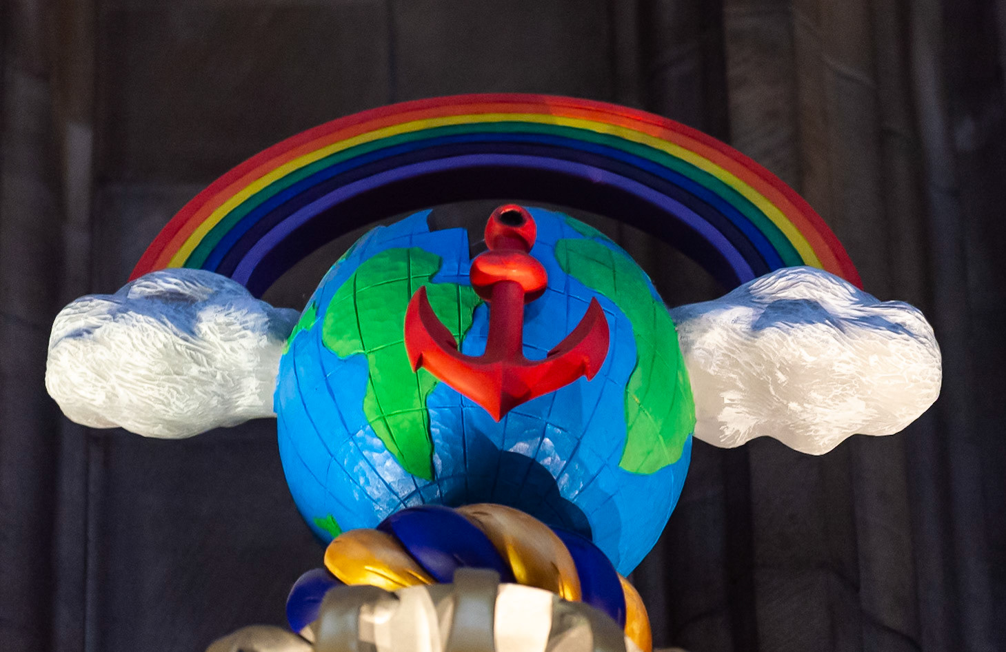 This crest includes a world globe.