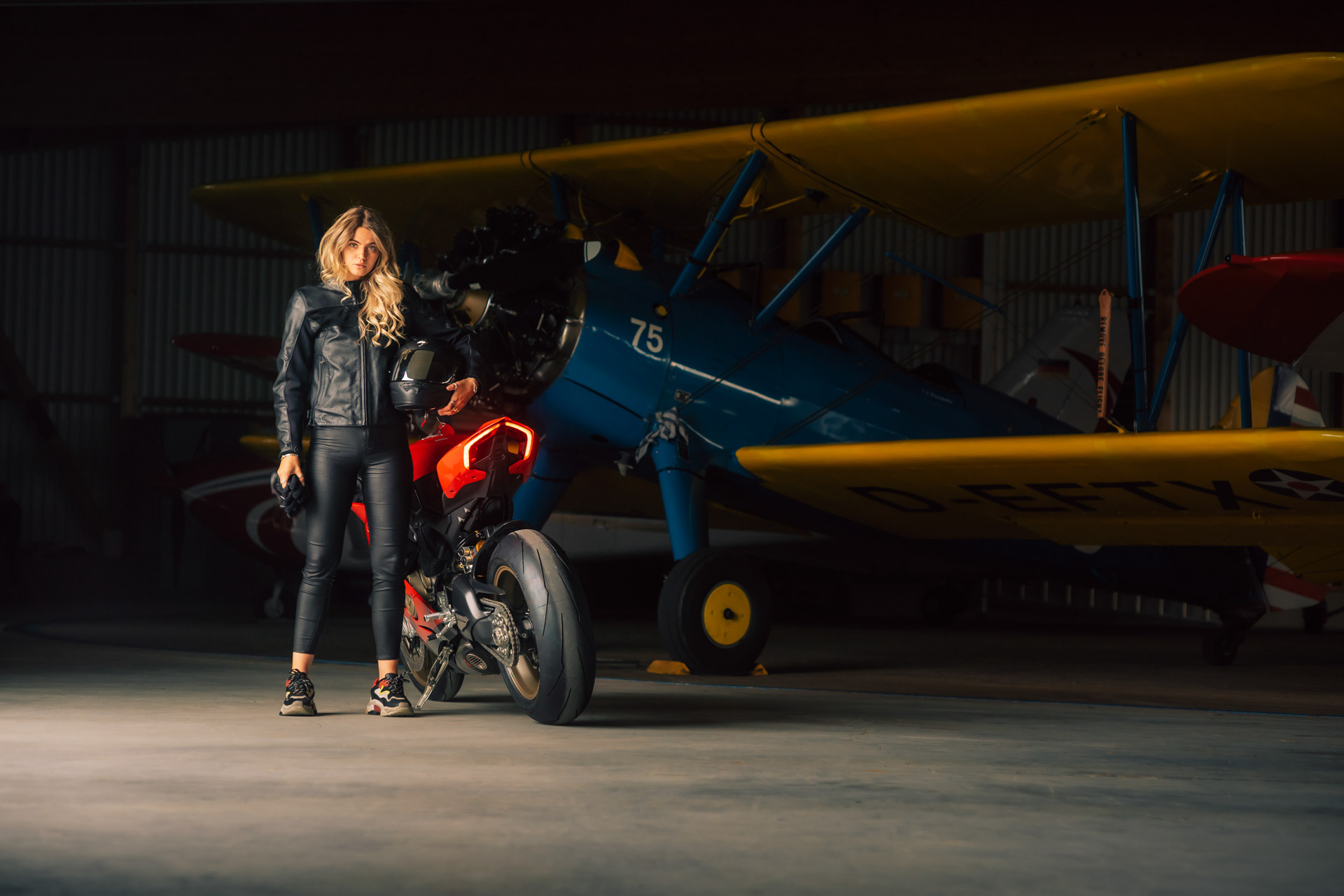 Nadine Wimmer X Ducati Panigale V4 in front of Boeing Stearman at Jesenwang Airfield