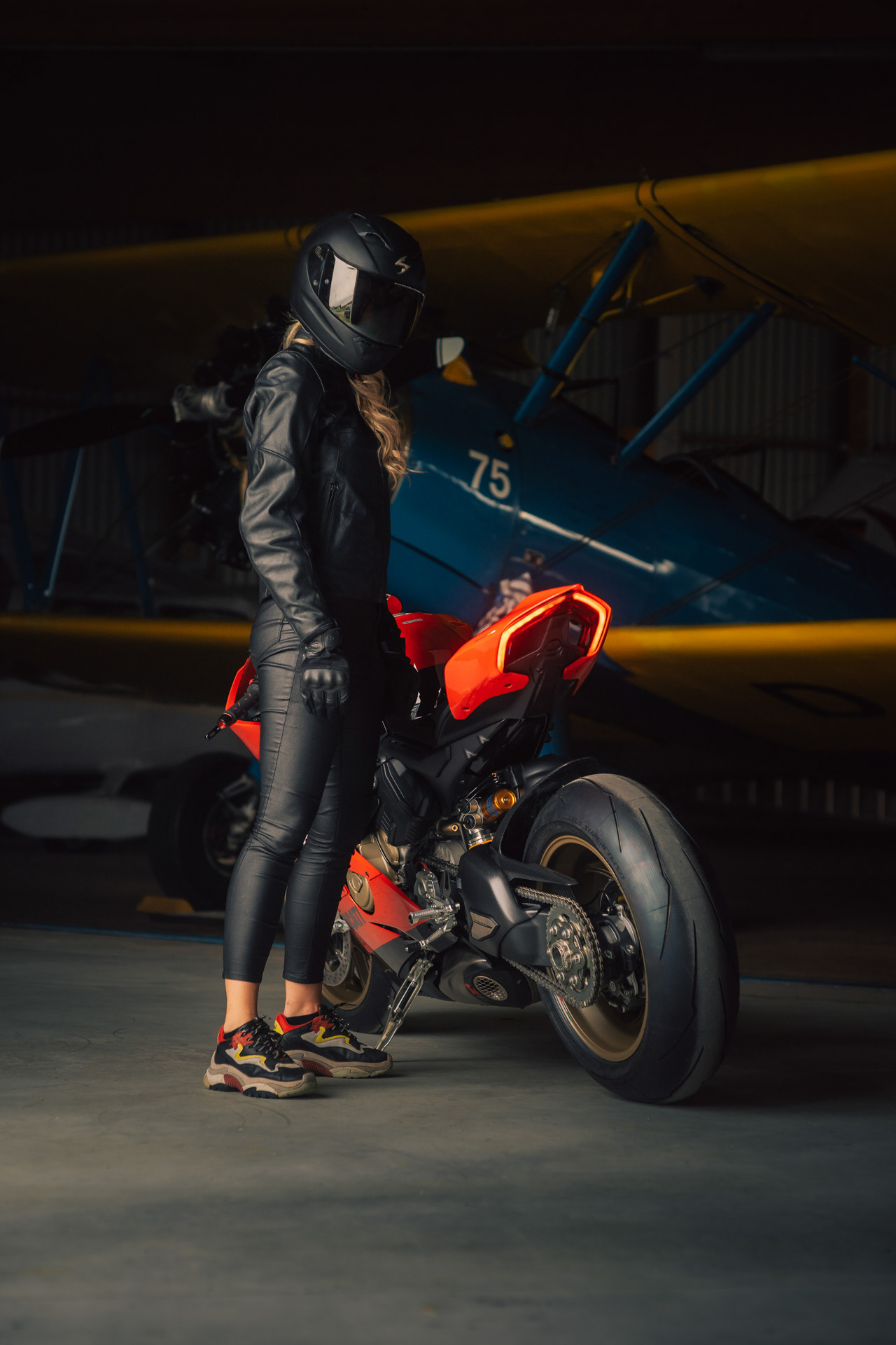 Nadine Wimmer X Ducati Panigale V4 in front of Boeing Stearman at Jesenwang Airfield