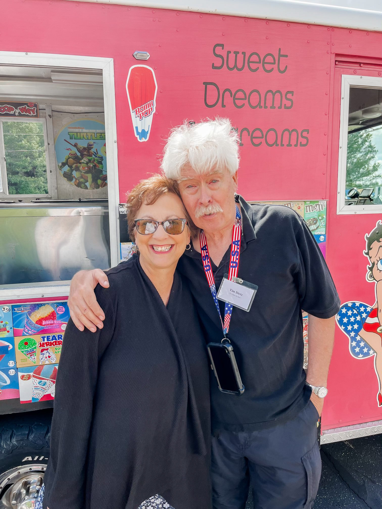 Author Sandra Modena and Ice Cream Man Mr. Tim of Rockford, Michigan, standing together