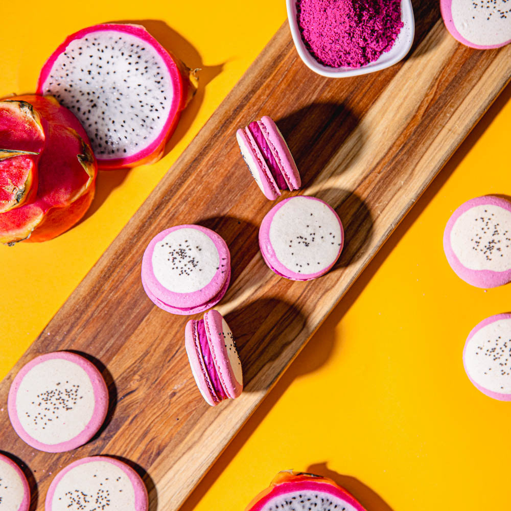 Dragon Fruit Macarons: Almond Shells with Dragon Fruit Buttercream topped with Poppy Seeds