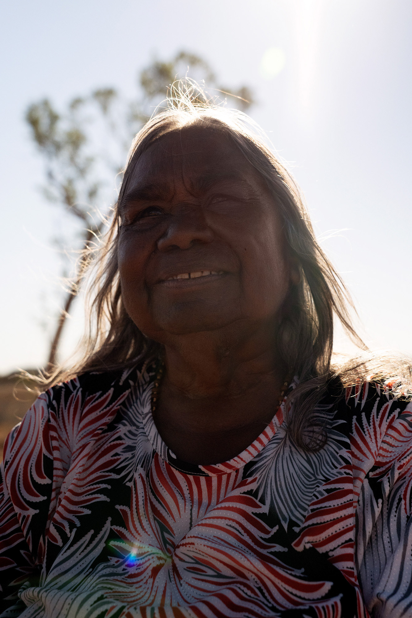 Kathleen Kemarre Wallace, an Eastern Arrernte woman, born in the Central Australian bush, and raised at Santa Teresa Mission from age 13. While at the mission, she was told to give her stories away, to forget them. But she refused and has kept them strong all her life.