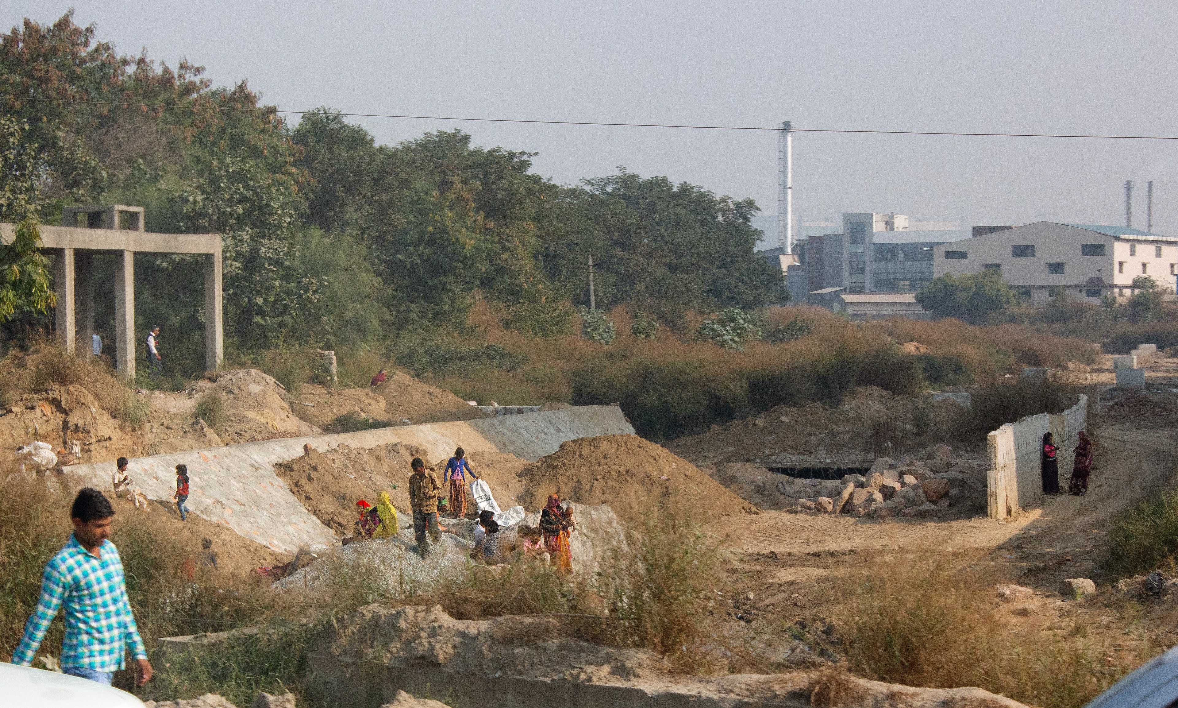 Without proper support or funds, many women bring their children to work at building sites such as this.