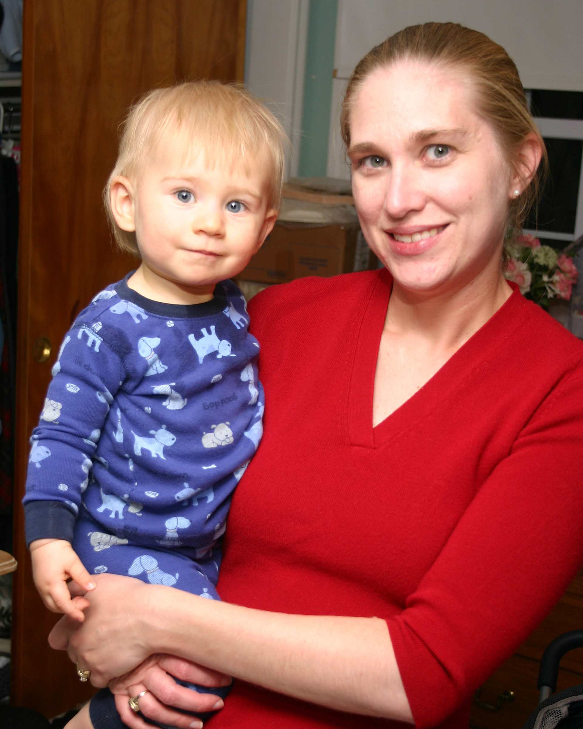 Proud mom pausing for a moment during a busy day.