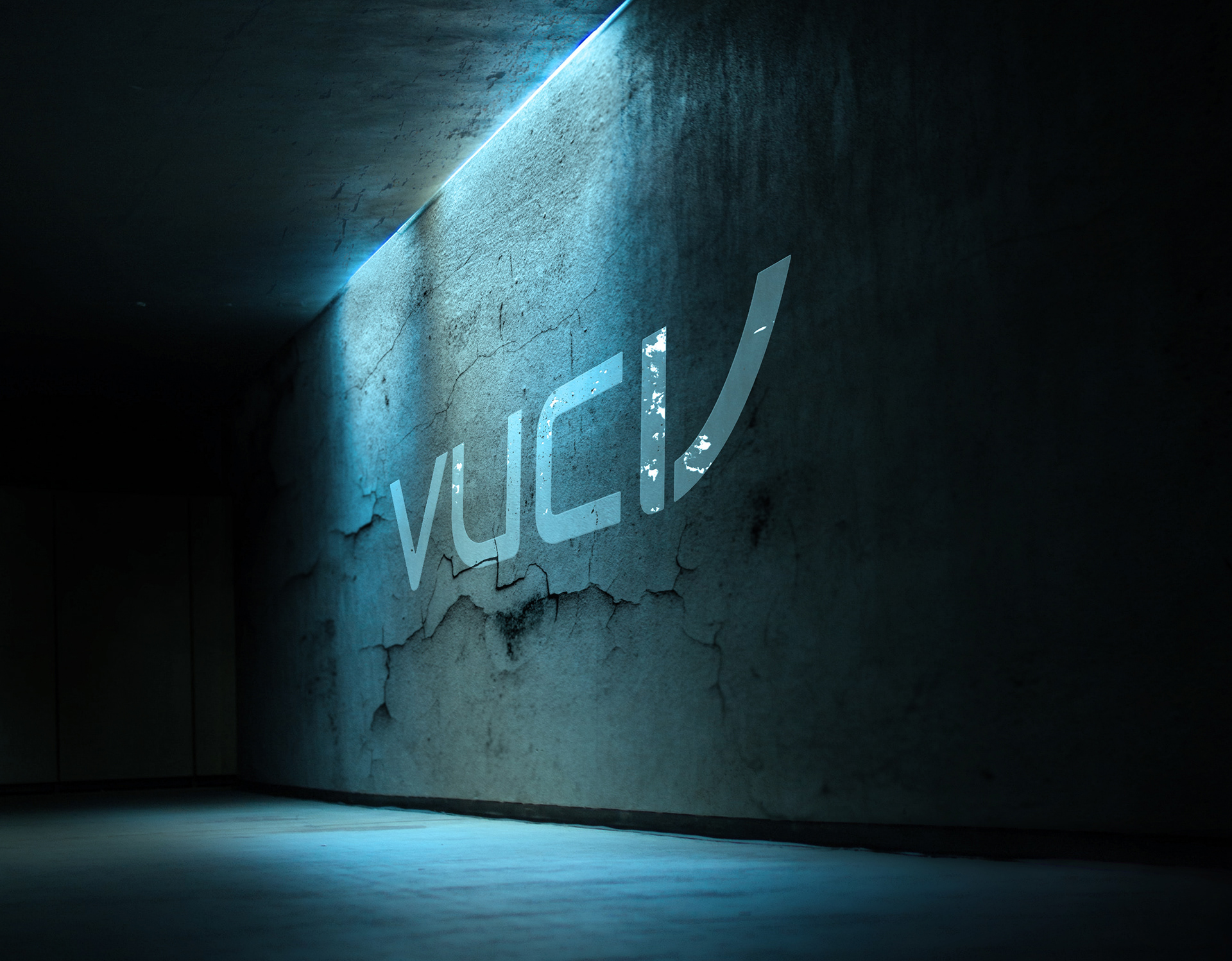 VUCVs logo spraymalet på betonvæg i kælder, cool stemning
