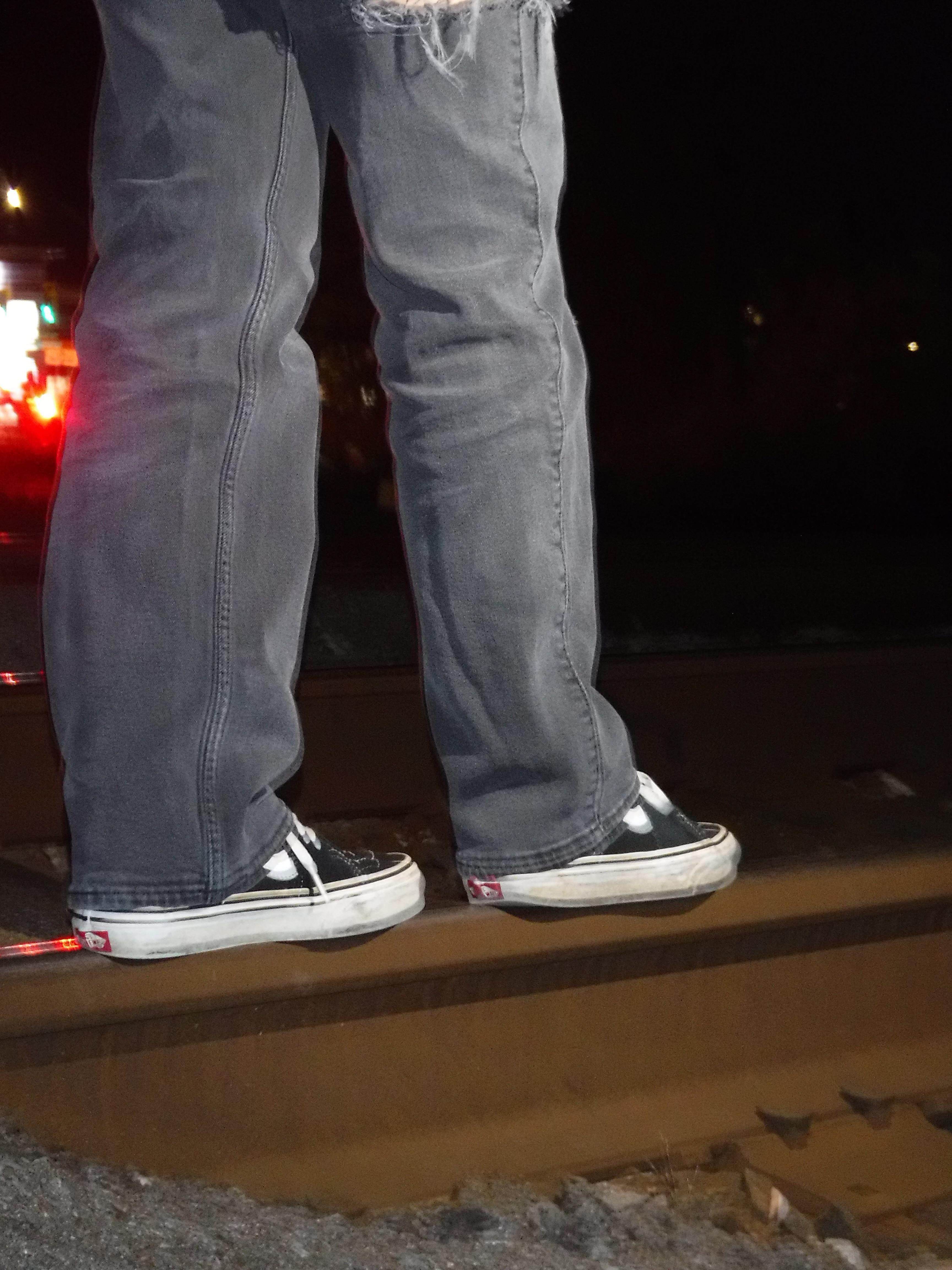 Me walking on a railroad track in my Vans