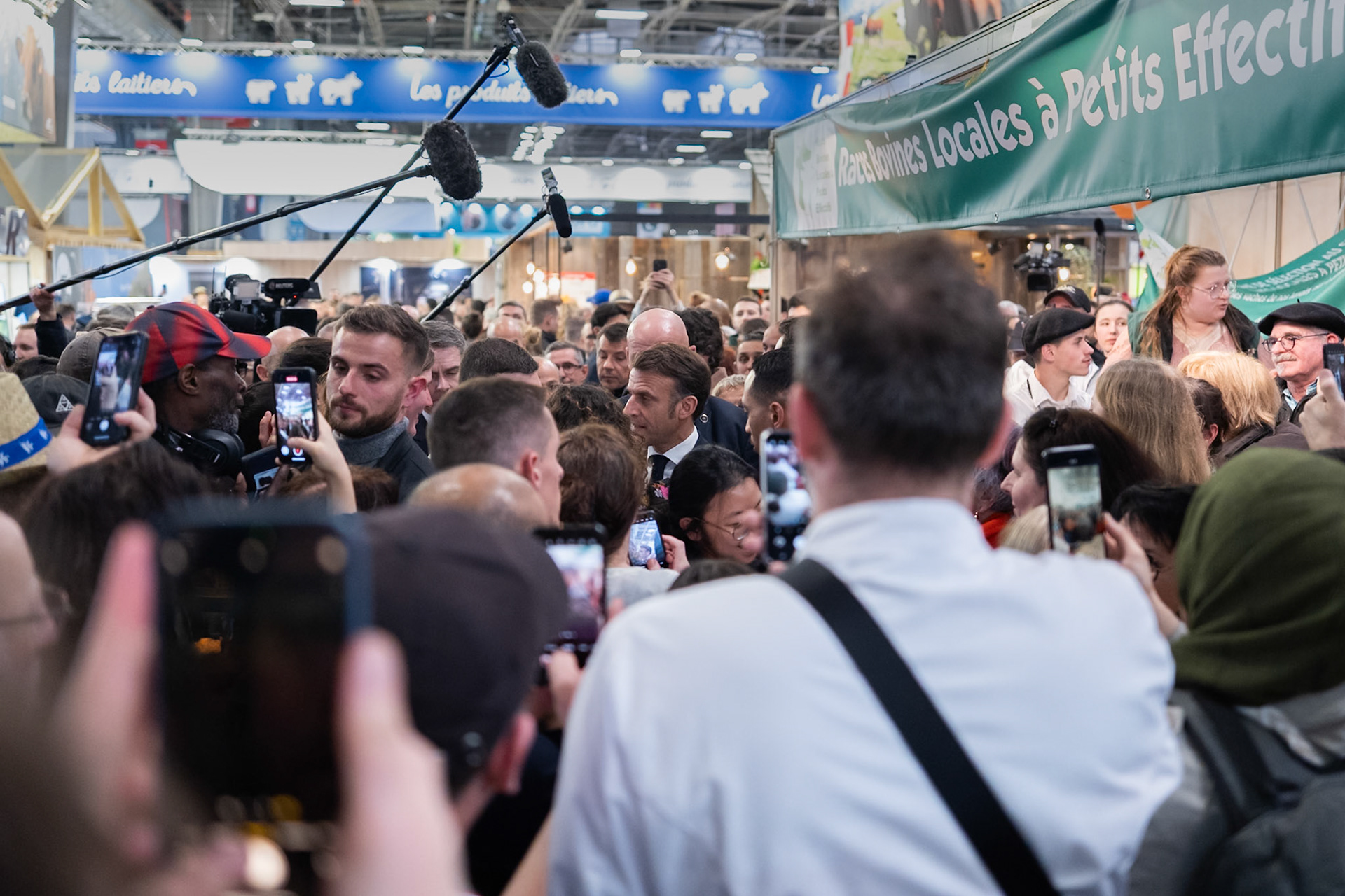 Macron talking to visitors of the Salon D'Agriculture (Agricultural show) 2025, in Porte de versaille, Paris, France. On the opening day February 22nd. After the official opening of the Salon, Macron visitied all stalls of Pavillion 1 and talked with various visitors. Paris, France, by Maria KALAFATSI