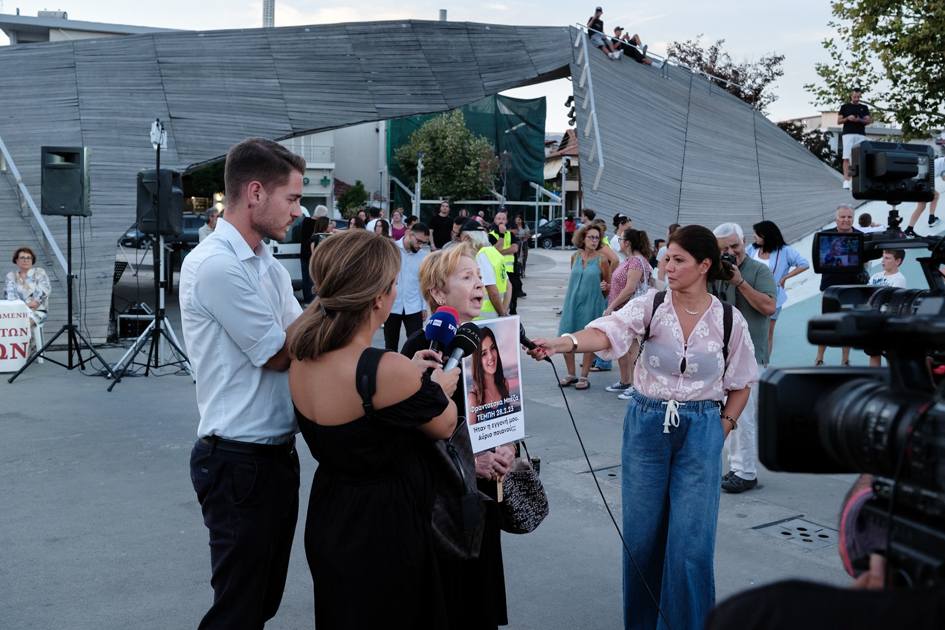 Vasiliki, who lost her grand-daughter Frantzeska Mpeza, talking to the media before the event dedicated to the victims of the train wreckage of Tempi 2023. Organised by local ngo Kialli of Thermi & supported by the local community. Thermi, Thessaloniki, Greece, 10.09.2025 by Maria Kalafatsi