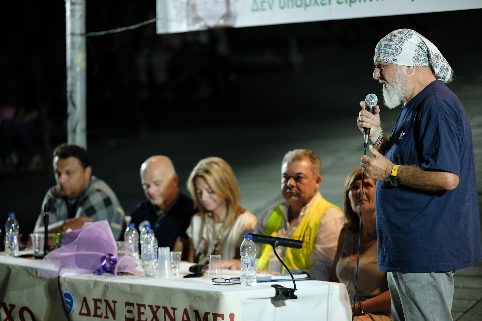 Member of Kialli, singing a song to bring all the crowd in silence. Event dedicated to the victims of the train wreckage of Tempi 2023. Organised by local ngo Kialli of Thermi & supported by the local community. Thermi, Thessaloniki, Greece, 10.09.2025 by Maria Kalafatsi