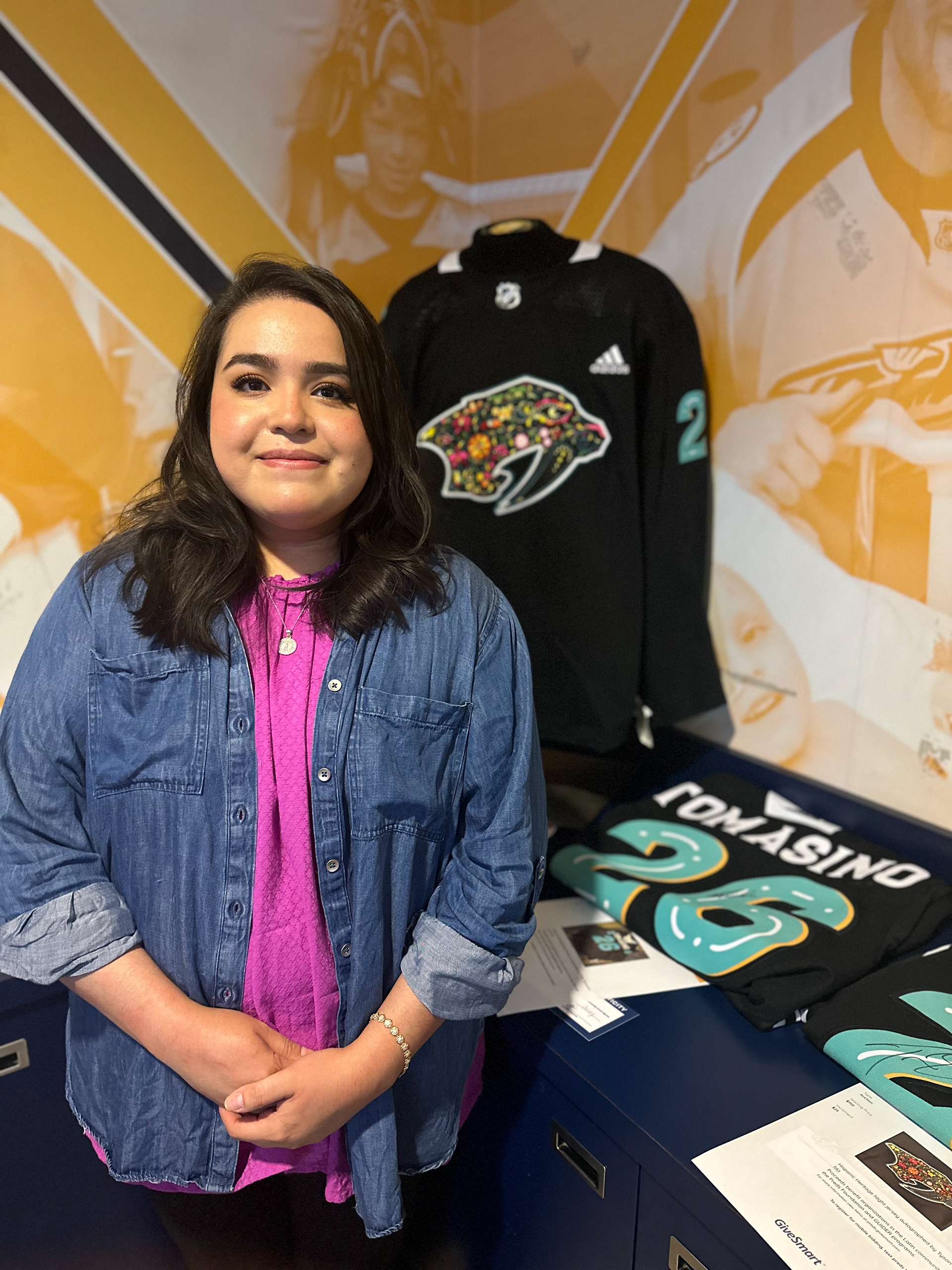 Me next to my design. It was a night to remember for me. I was so grateful for the opportunity to be the first Mexican-American designer for their  annual Hispanic Heritage Night Logo.