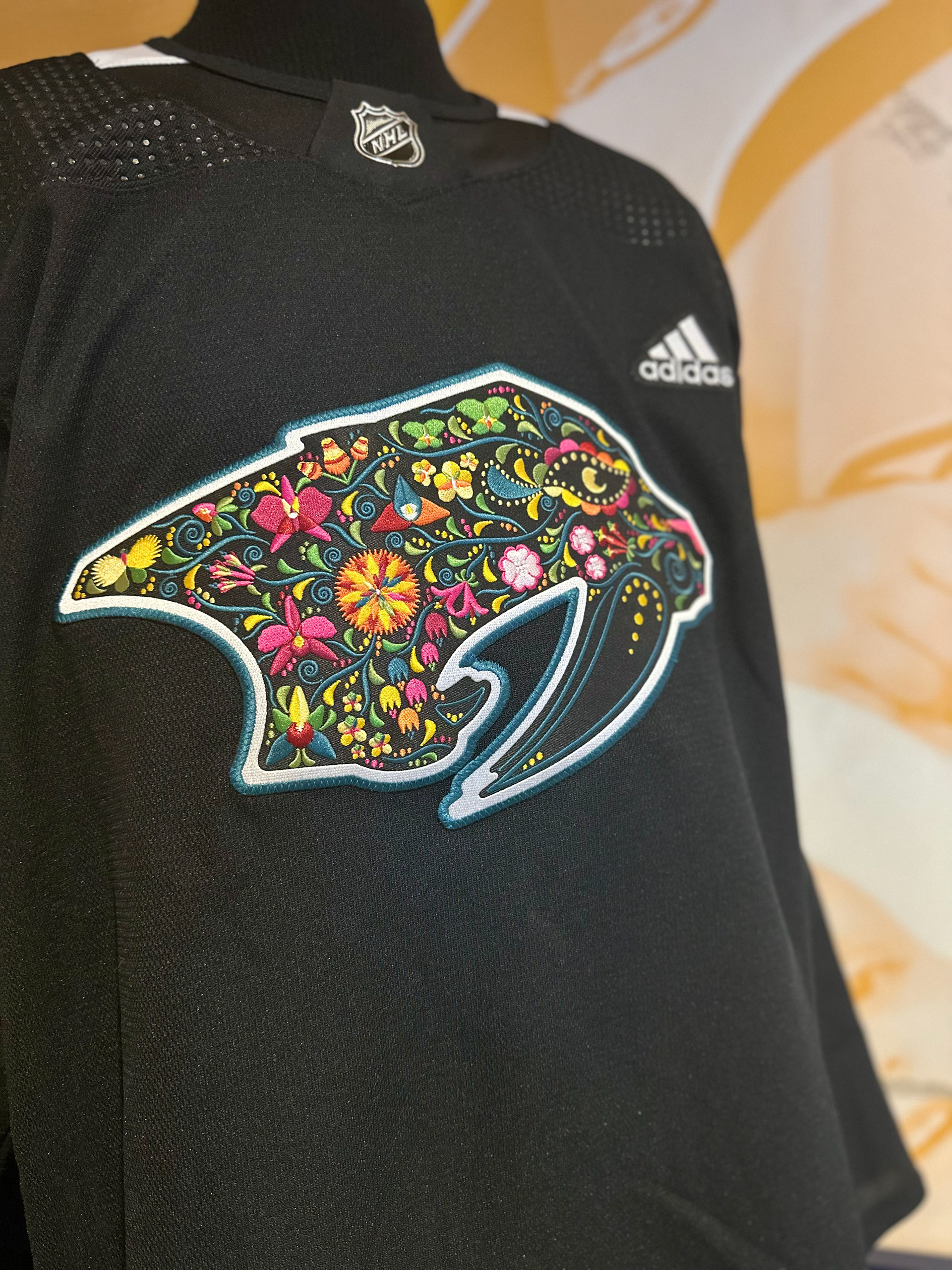 Close up: I was so excited when I saw the jersey close up. Originally this jersey was supposed to have a printed logo on it but I suggested they do an embroidered logo. Since the original plan was to do a printed logo, I was so delighted to see the embroidered effect on the logo and the overall design. The embroidery definitely elevated the design and brought to life my vision for the logo.  