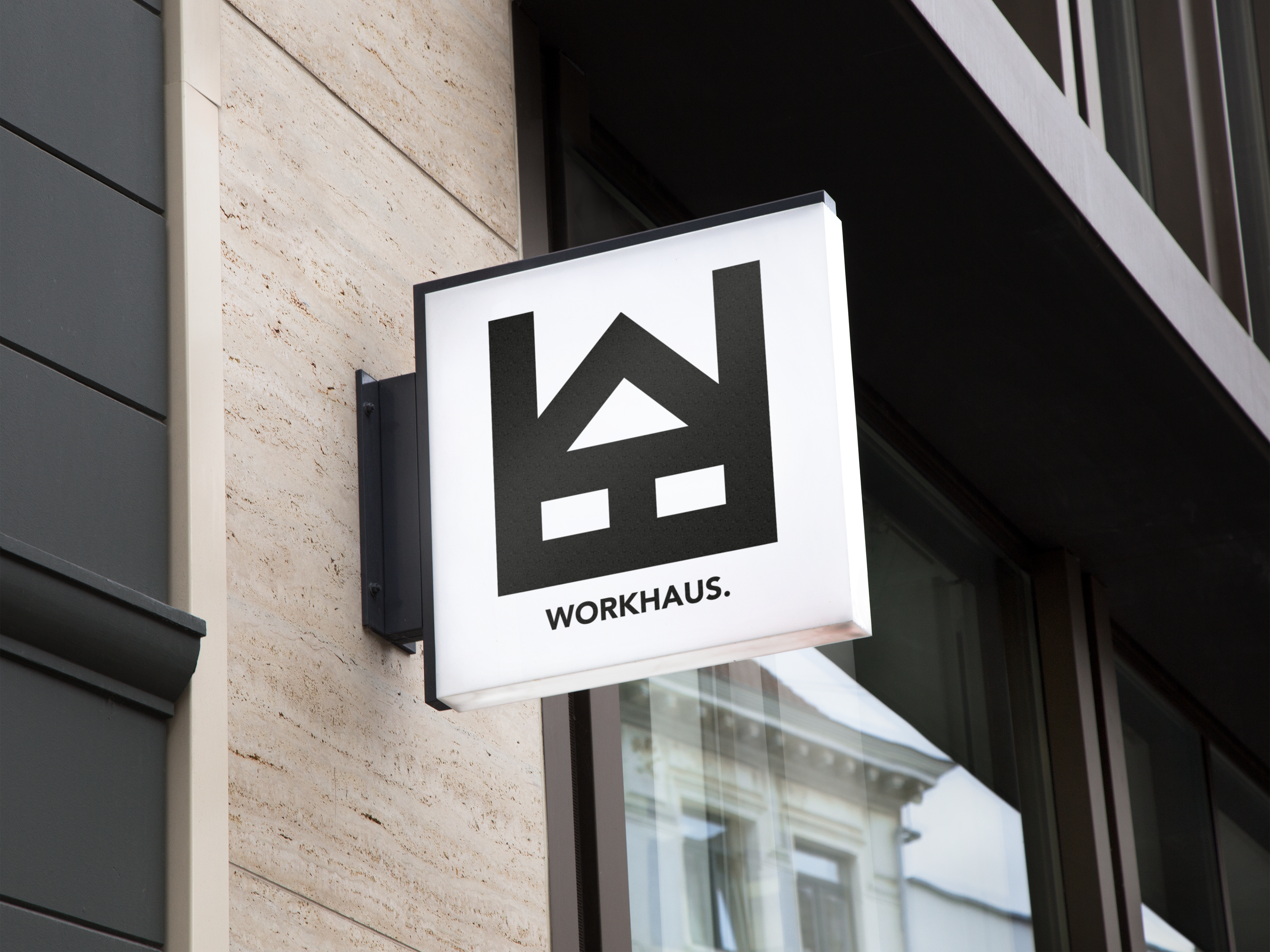 Lightbox signage with the Workhaus logo.