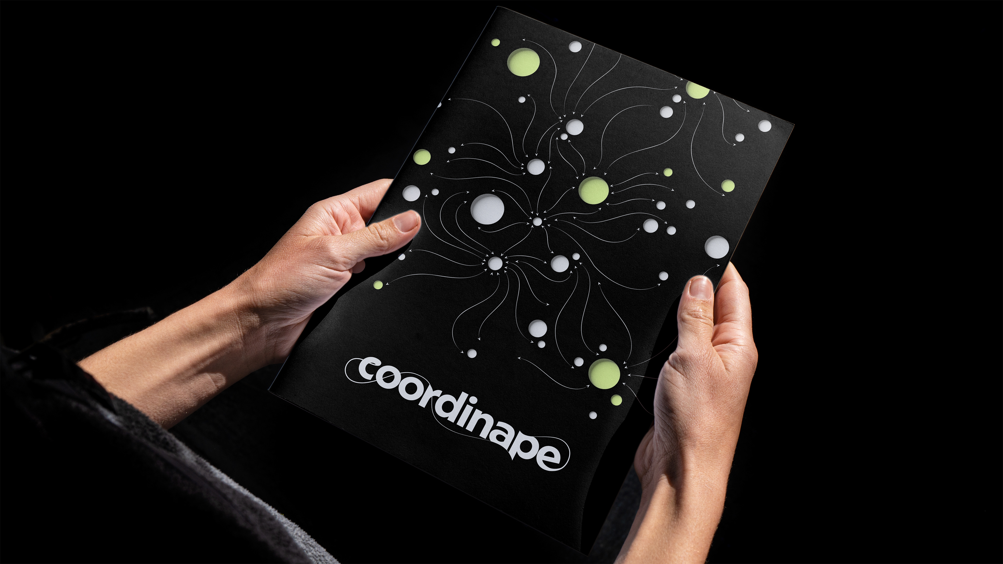A coordinape branded booklet with orbs and lines moving in space.