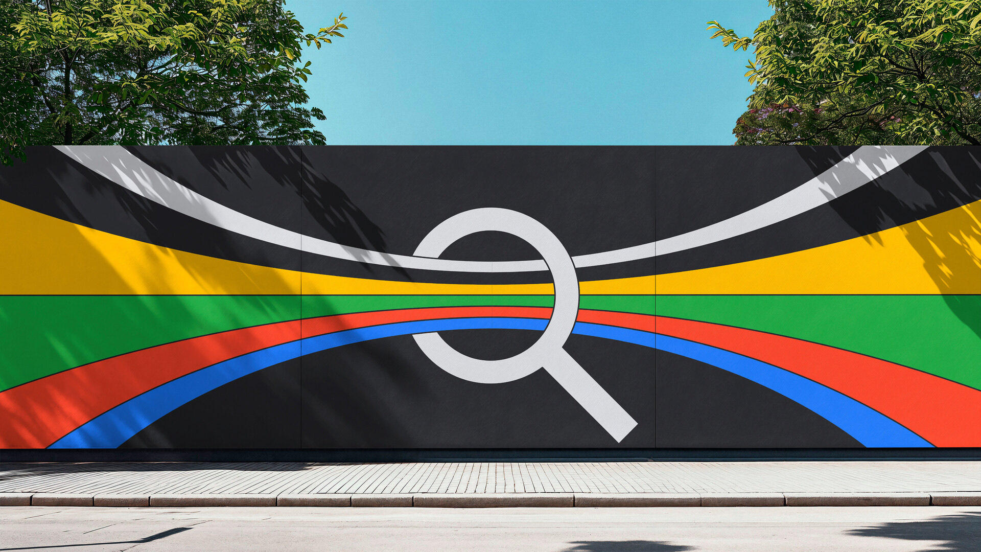 A colourful outdoor mural featuring the infamous Google search magnifying glass icon with Google branded colours passing through its prism reminiscent of Pink Floyd's The Dark Side of the Moon album cover.