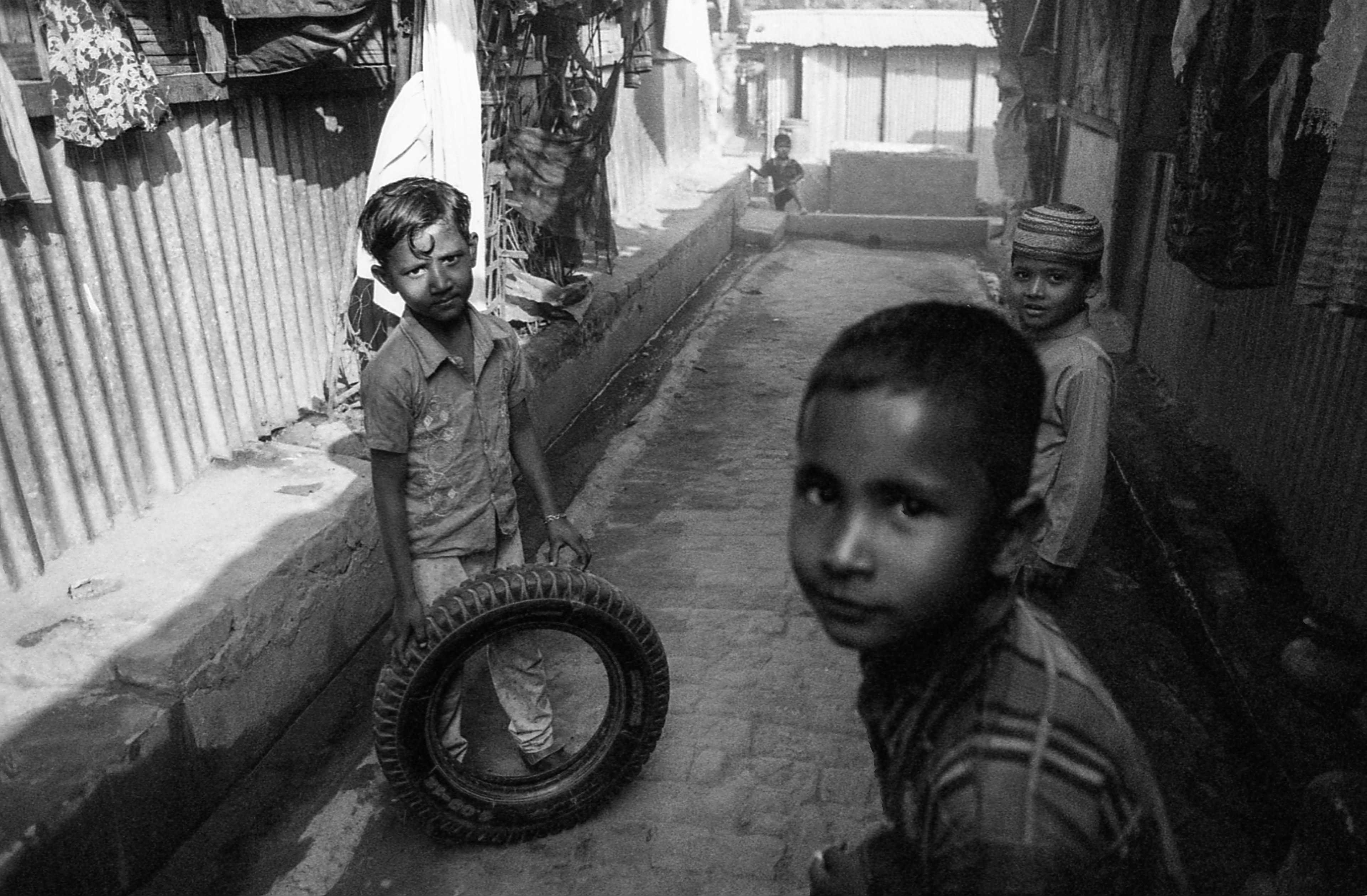 Leda Camp, Teknaf, Bangladesh. Boys play with a rubber tire.