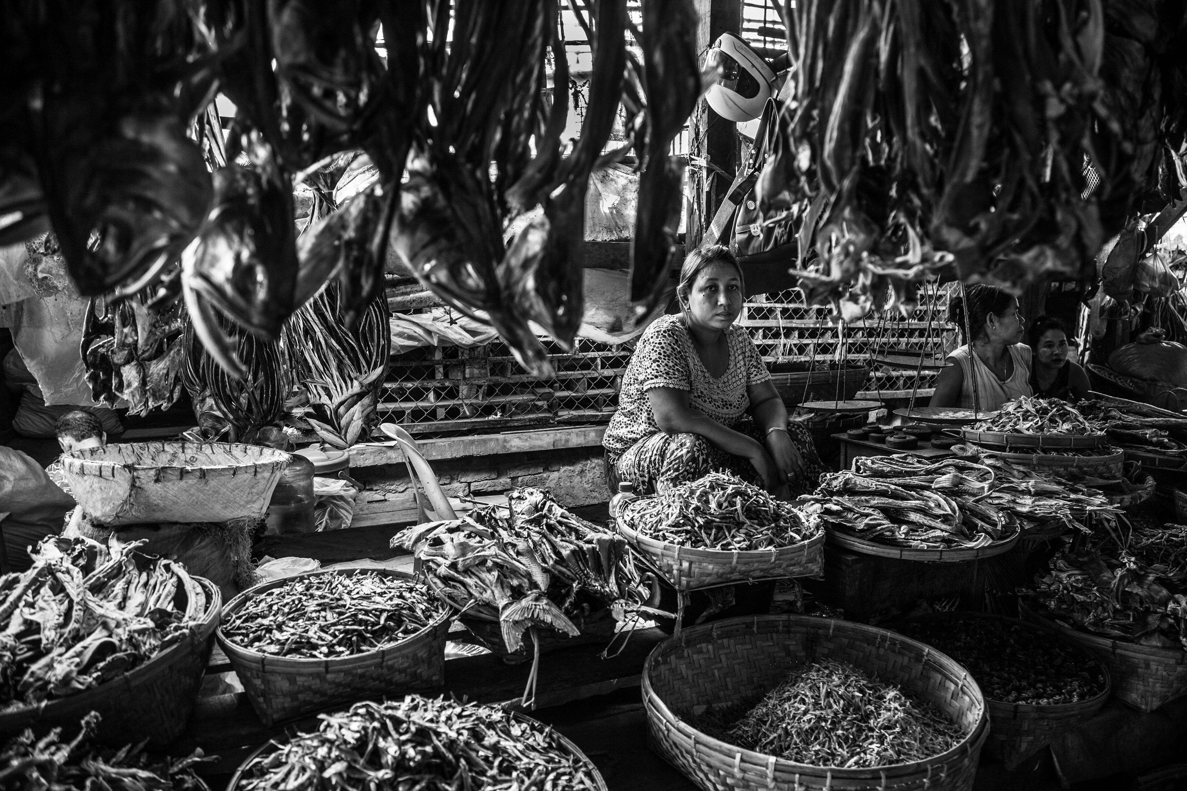 "Inside Sittwe Market." Sittwe, Myanmar. May 2016. Rohingya and Rakhine Buddhists once traded freely in this large market, but after waves of violence in 2012, there are no longer Rohingya-owned stalls or boats that operate here. All but 4,000 or so Rohingya remain in Aung Mingalar, which had a population of more than 15,000 before 2012.