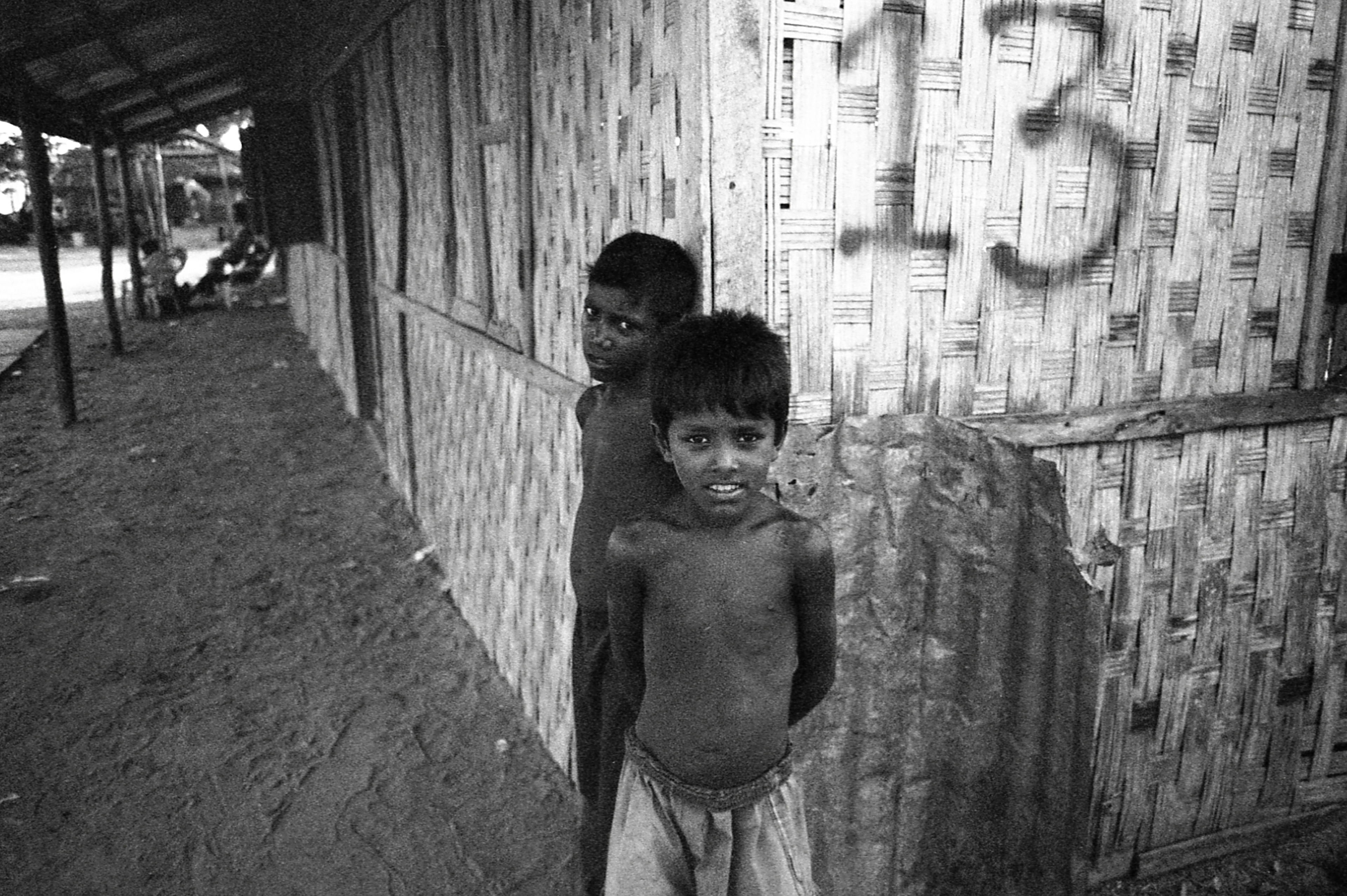 Baw Du Ba IDP Camp, Myanmar. Two boys in front of another abandoned school.
