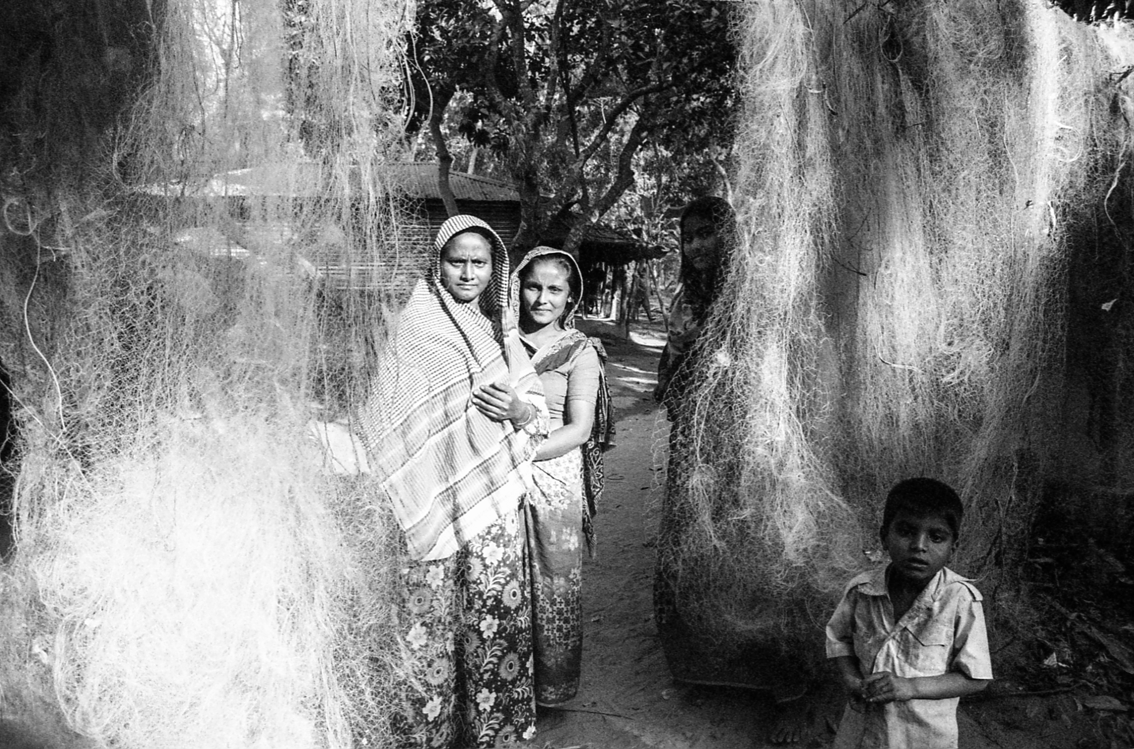 Shamlapur, Bangladesh. A Rohingya family tending to their fishing nets.
