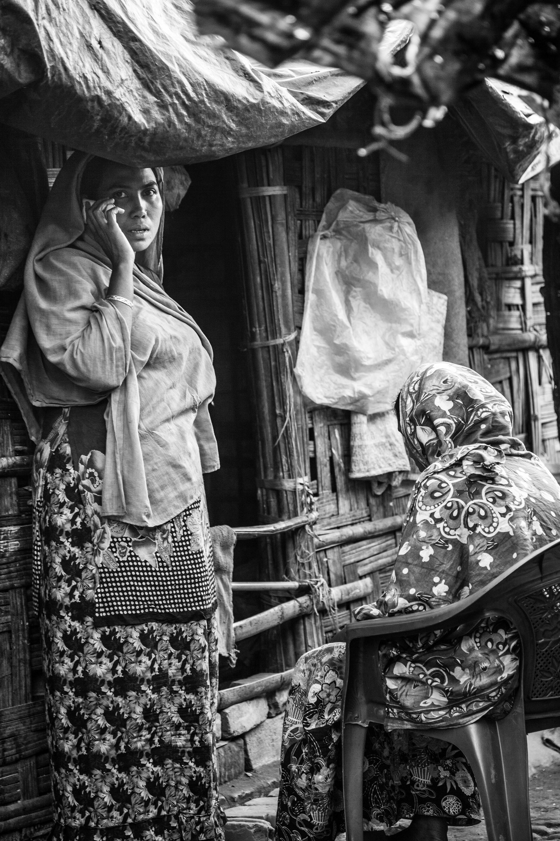 "In the Shadows." Leda Camp for Unregistered Refugees, Teknaf, Bangladesh. Jan 2016. Leda Camp is a makeshift refugee camp near Teknaf in the southern part of Cox’s Bazar District, originally established in 2001. Arbitrary arrest and violence towards the Rohingya is commonplace as they have no rights here in Bangladesh or back home in Myanmar. Many Rohingya, especially women, have been locked up or beaten simply for having a cell phone in their possession.