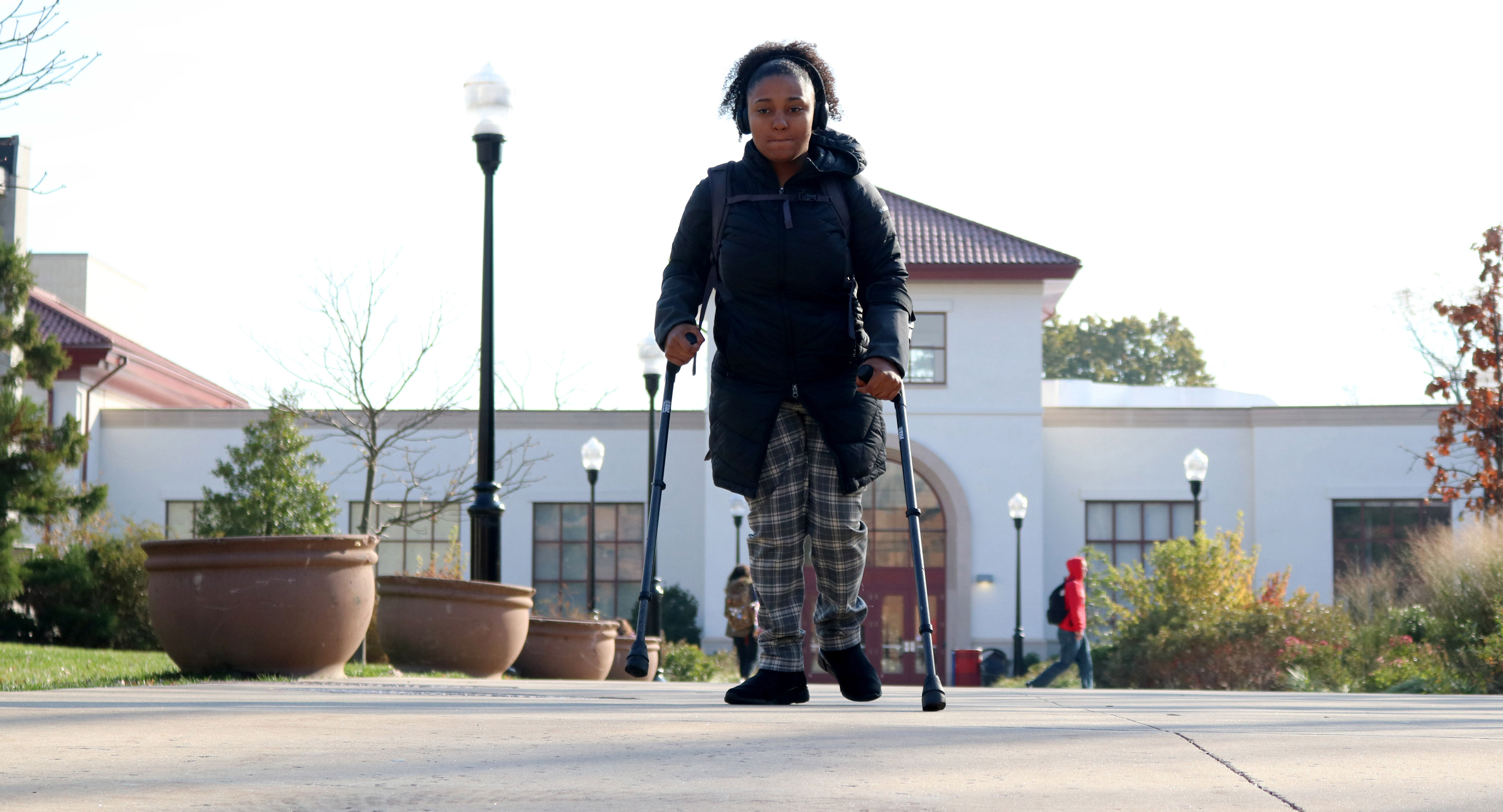 MONTCLAIR, NJ 11/11/2019 THE TREK: Trinity Corney decides to walk to Calcia Hall from the School of Communications and Media (SCM) instead of using the shuttle services provided for her through her disability. She loses her breath while walking to her destination but reamins determined to reach her end goal.  -Photo by Sunah E. Choudhry
