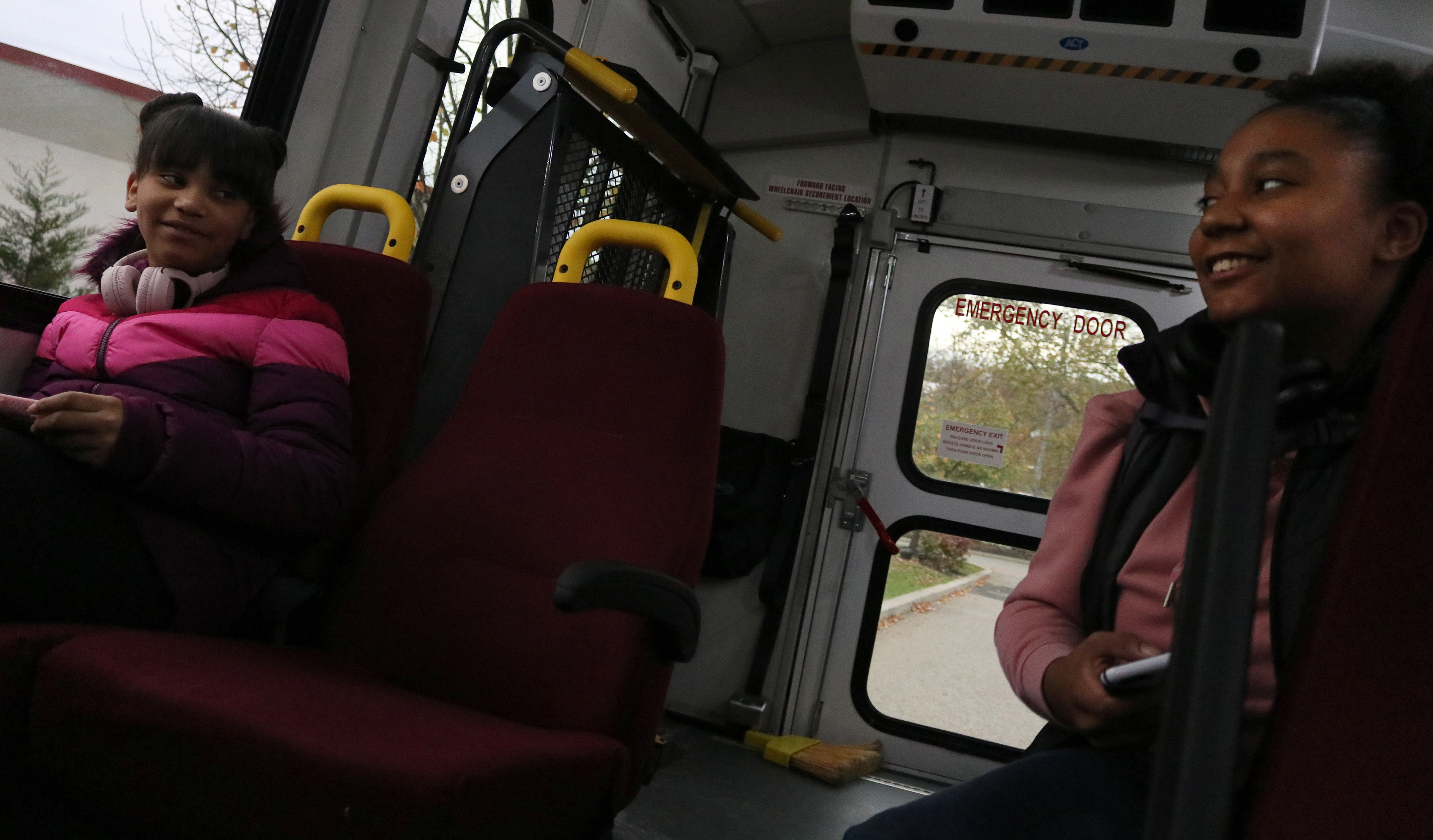 MONTCLAIR, NJ 11/08/2019 TRINITY AND HER SISTER: Trinity Corney and her sister Ava Miranda ride on the Persons with Disabilities (PWD) shuttle. Corney asks Miranda what she is going to do while she’s in class and she responds by saying she’s got homework to complete. Miranda got a day off because of a teacher convention being held for her teachers. -Photo by Sunah E. Choudhry