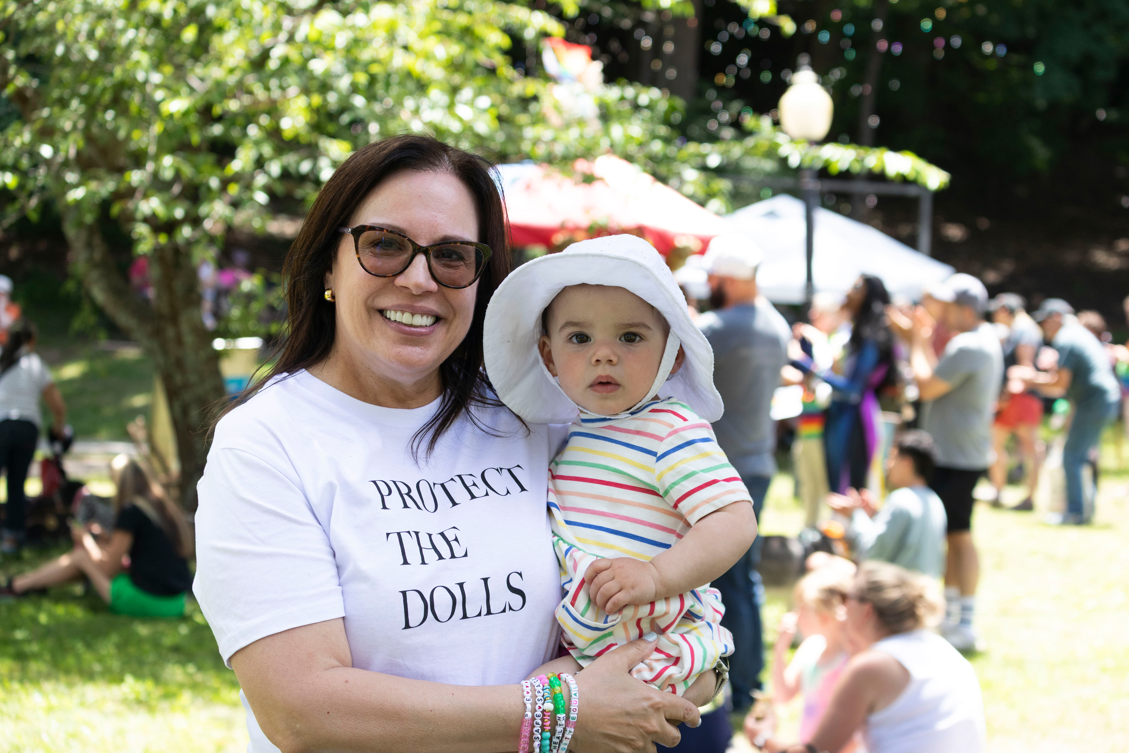 BOONTON, NJ 06/20/2026 BOONTON PRIDE AT GRACE LORD PARK: A woman holds her child while posing for a photo. (Photo/Sunah Choudhry)