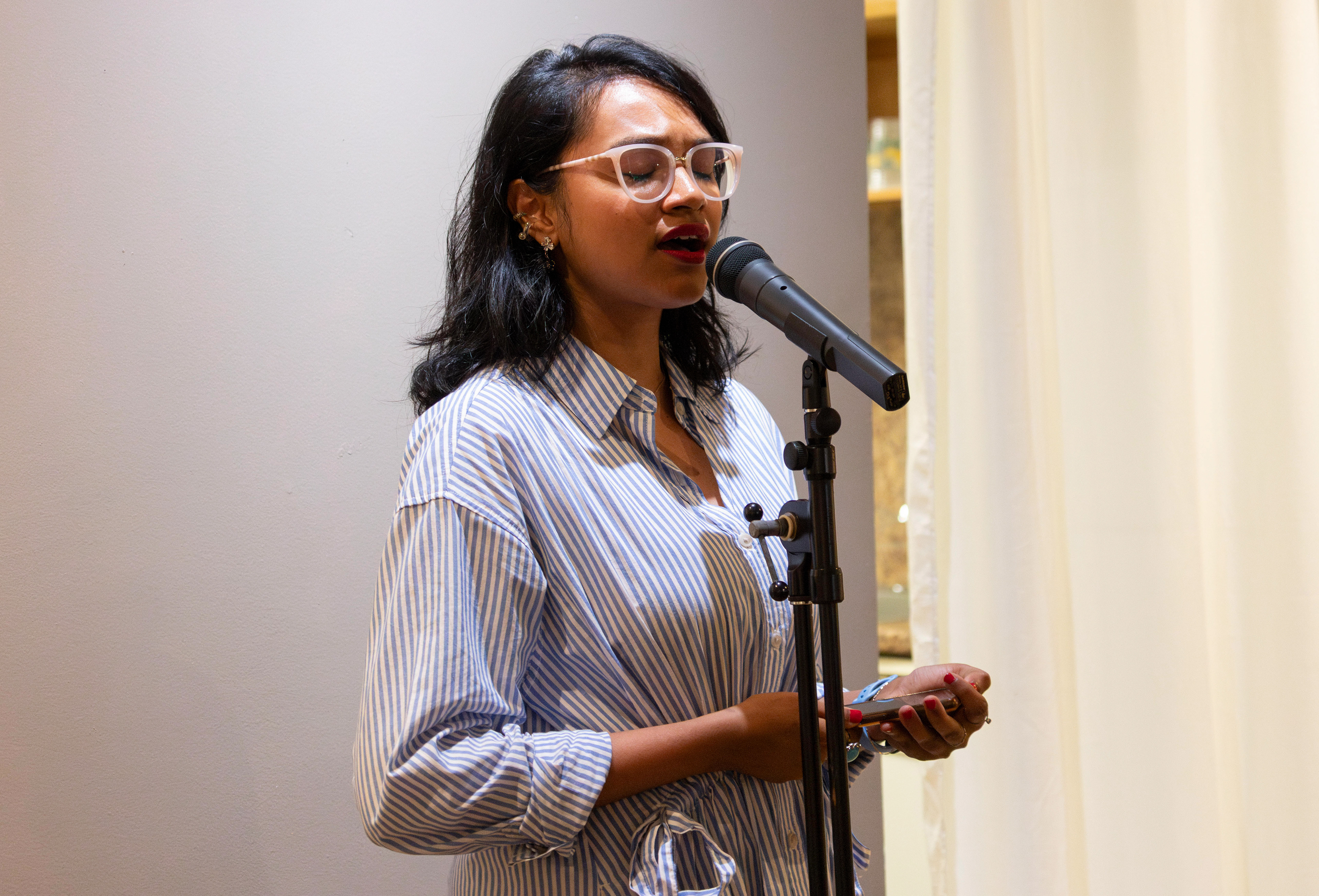 NEW BRUNSWICK, NJ 06/20/2026 CANVAS AND KAHANI: Singer @Rukkygotjams performs a song at Canvas and Kahani. Central Desi, a South Asian news publication, hosts its first-ever art showcase and open-mic at Alfa Art Gallery on Church Street. Photo by Sunah Choudhry.