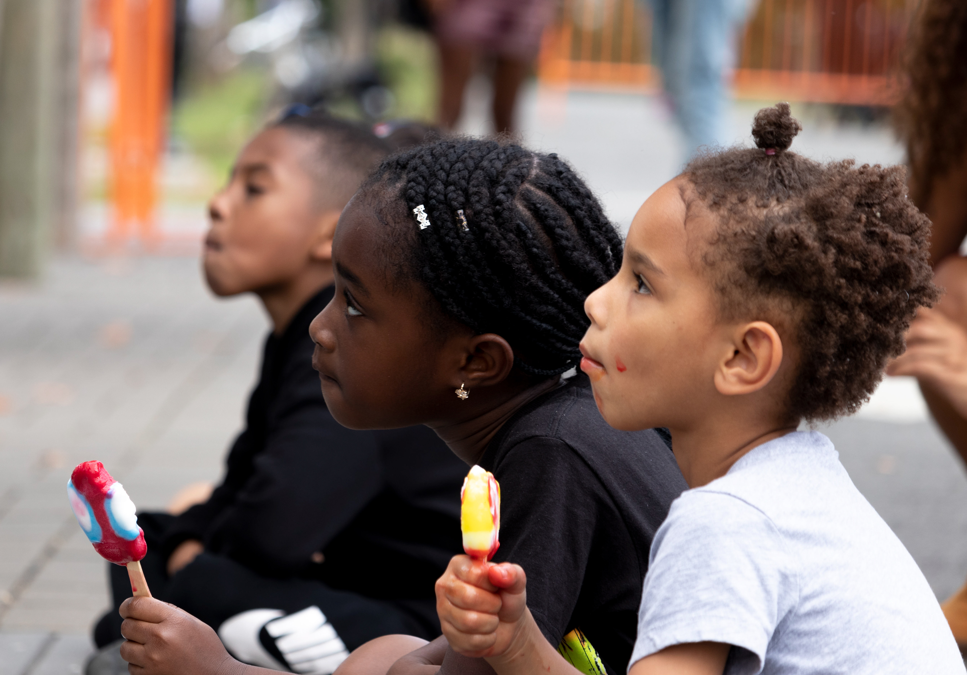Children listen to a Drag Queen Story Time session at Berry Lane Park at the Kemet Festival in Jersey City. (Photo/Sunah Choudhry)