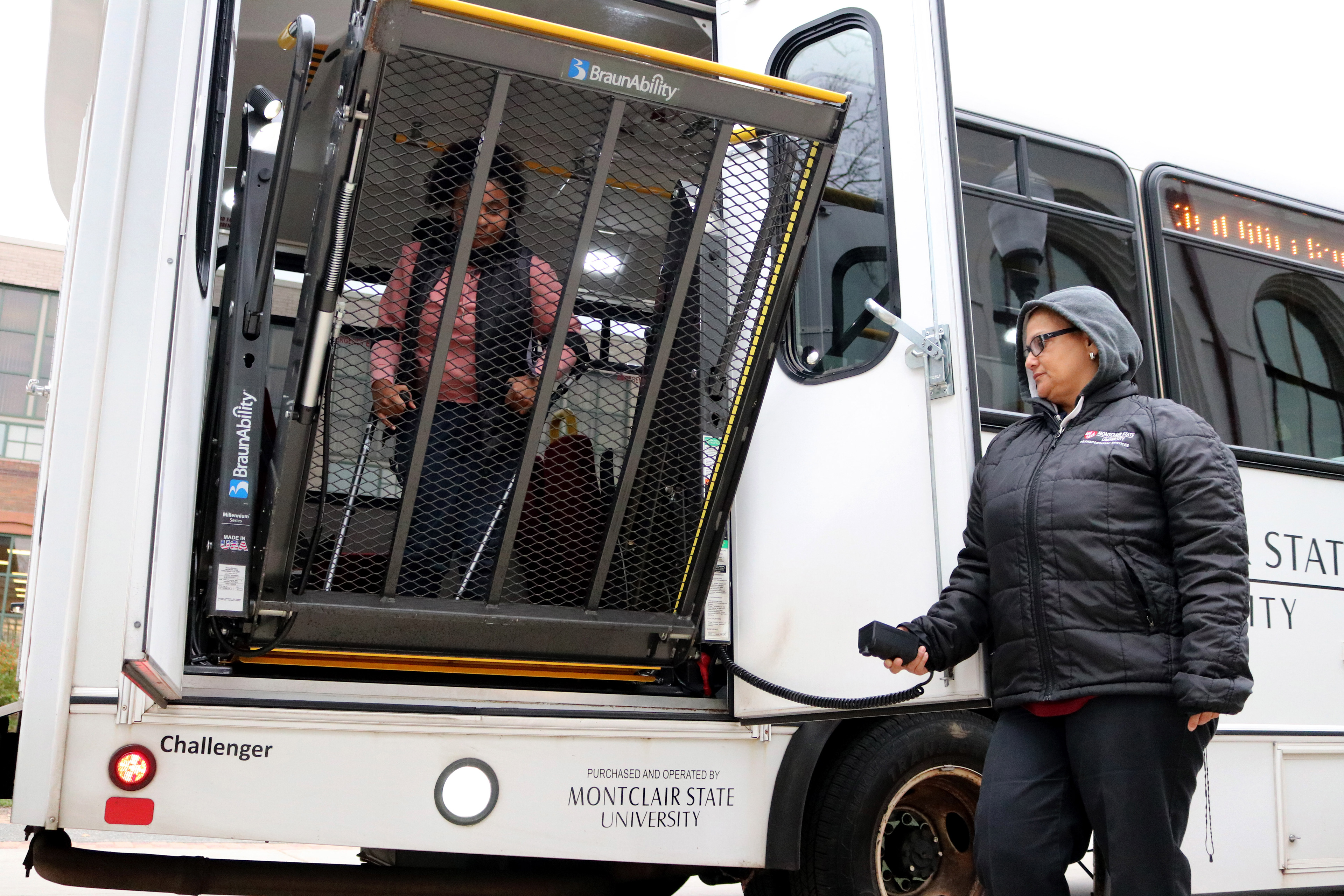 MONTCLAIR, NJ 11/08/2019 OFF THE SHUTTLE: Trinity Corney decides to utilize the shuttle to get to the School of Communications (SCM) and walks to the back of the bus rather than the front to descend off of a platform. The bus driver gets off the bus so the platform can actually come down by using a remote.  -Photo by Sunah E. Choudhry