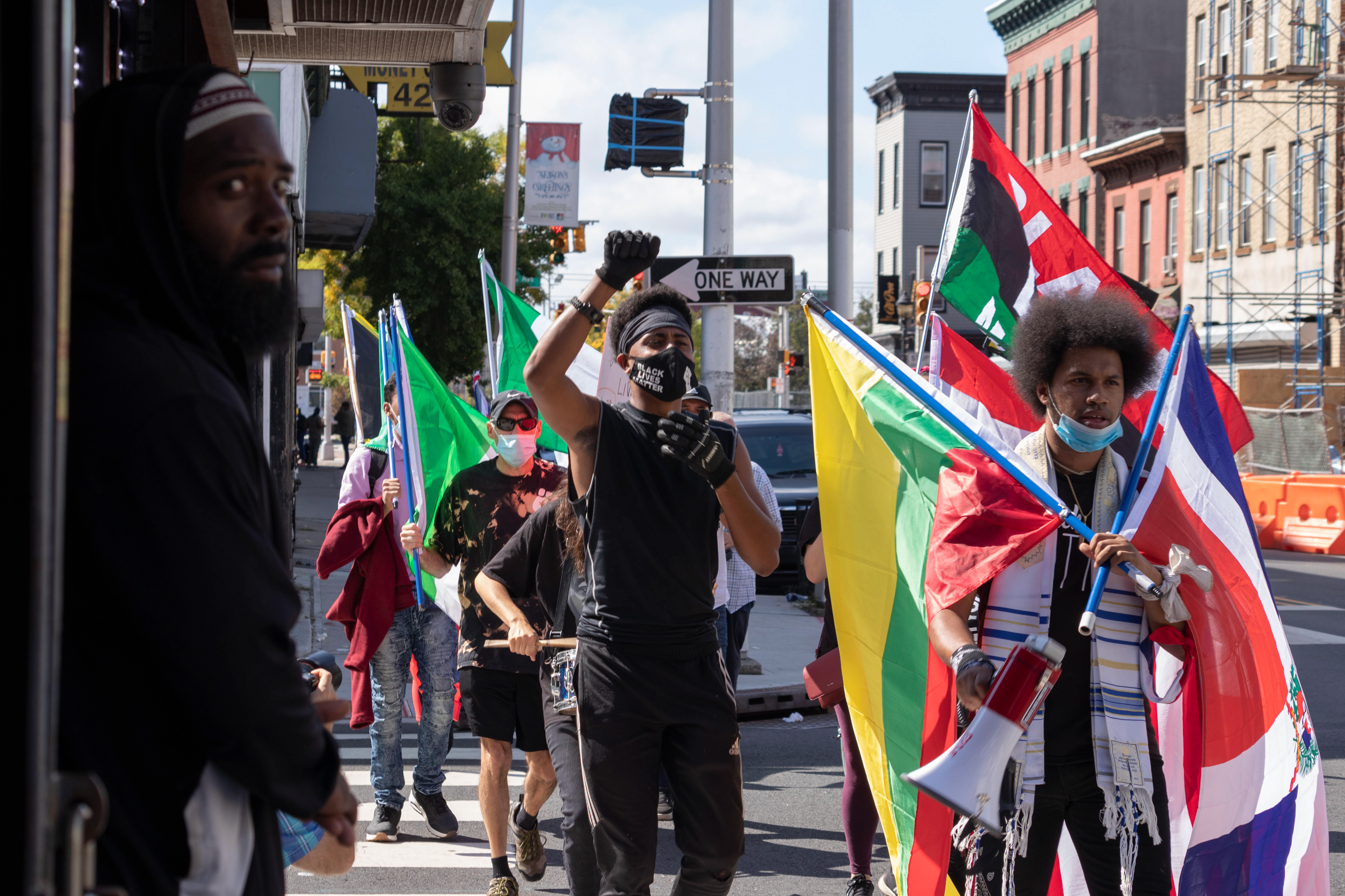 Protest organizers Boaz Matlack and Rostafa chant for a civilian complaint review board (CCRB) while making their way to Berry Lane Park in Jersey City. (Photo/Sunah Choudhry)