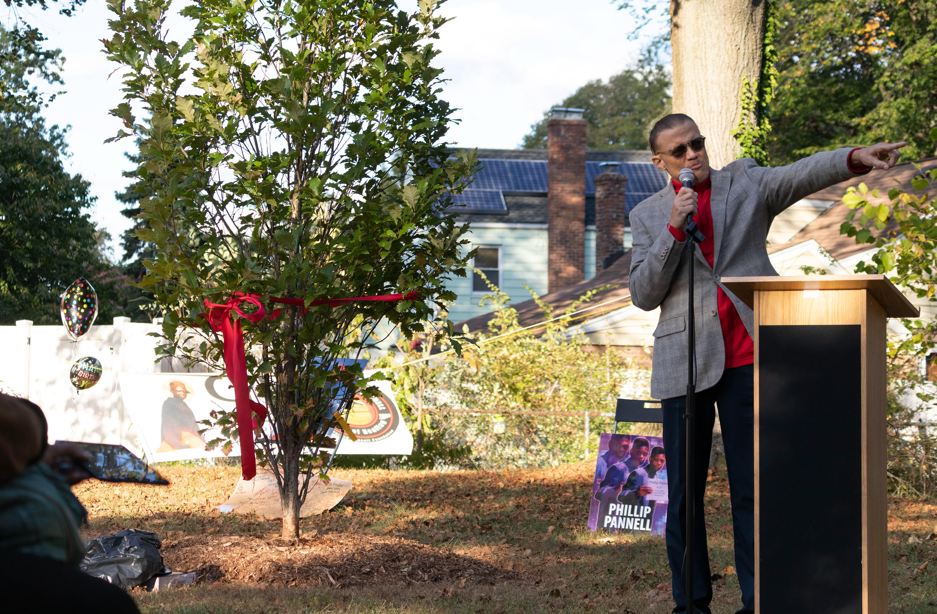 With Thelma Danzler from day one in support, Charles Webster points to the corner of Bernard E. Brooks Park where he remembers seeing the original tree in remembrance of Pannell cut down, burned, and put on his desk in the spring of 1993 in Teaneck on Saturday, October 3rd, 2021. (Photo/Sunah Choudhry)