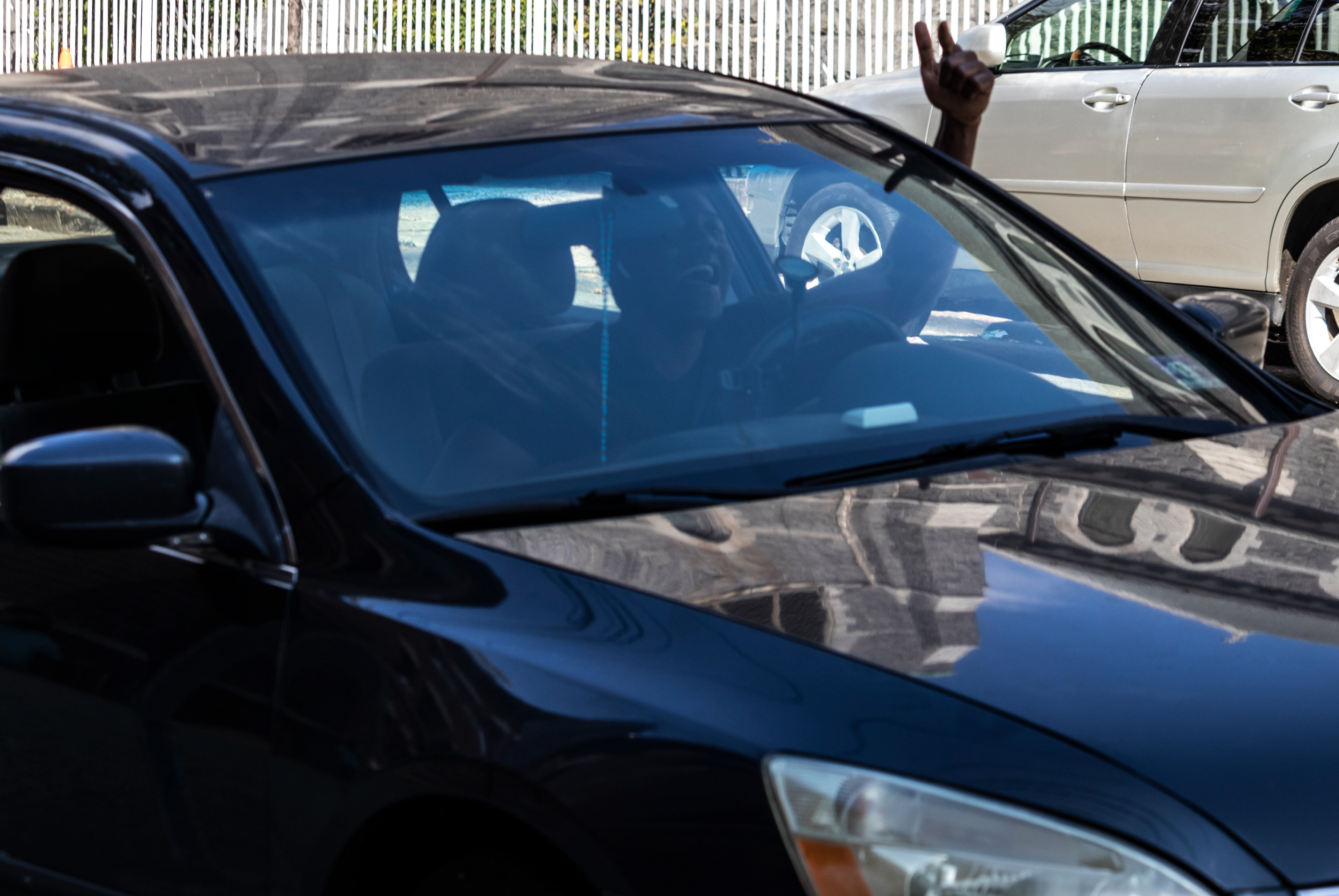 A man gets excited after seeing the peaceful protest and chants from his car in Jersey City. Photo by Sunah Choudhry.
