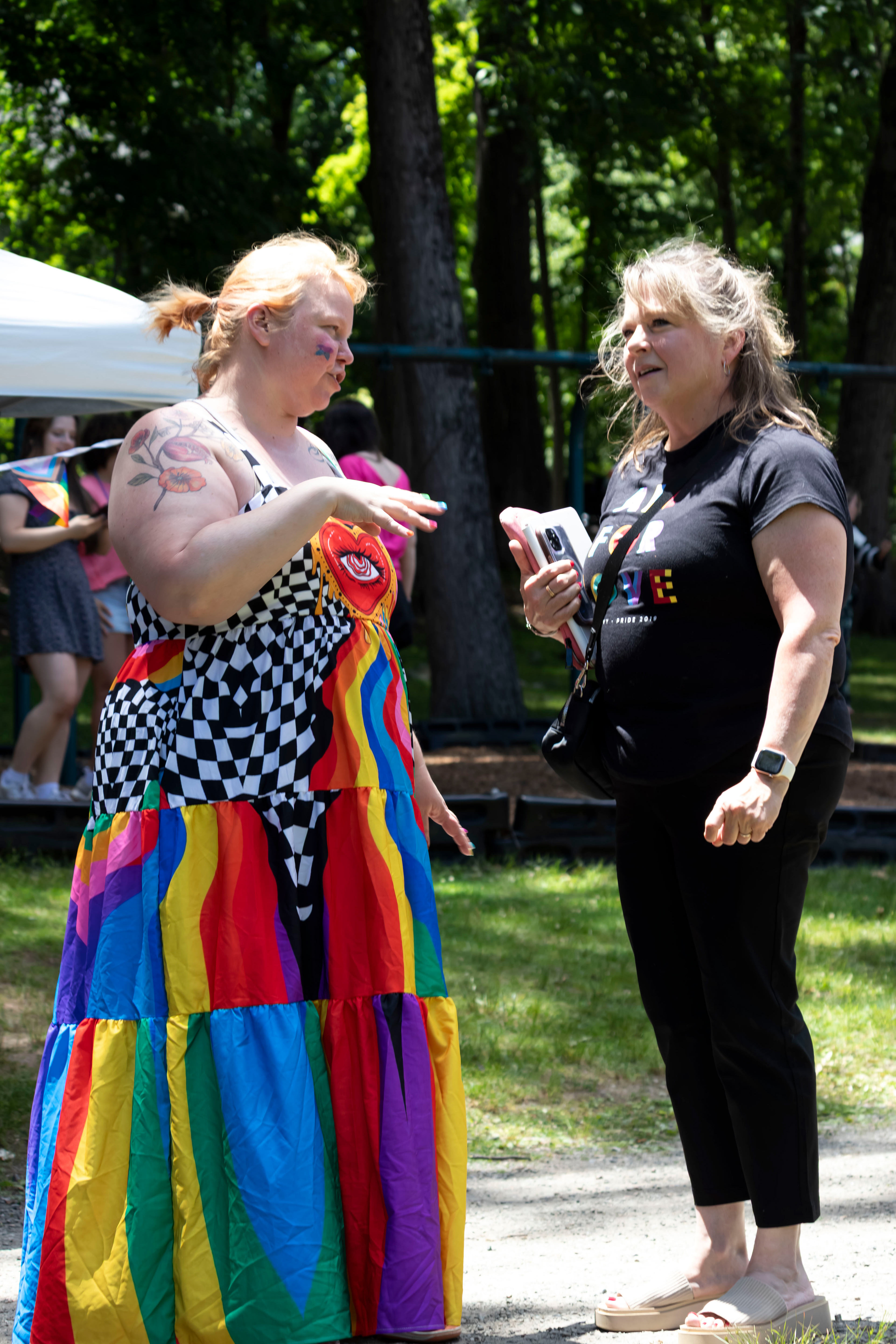 BOONTON, NJ 06/20/2026 BOONTON PRIDE AT GRACE LORD PARK: Co-President and Co-founder of Boonton Pride Lindsey Weisman speaks with an attendee at Boonton Rainbow Pride. Boonton residents and visitors gather to celebrate Pride, hear speakers and watch performances by the Mayo Performing Arts Company.