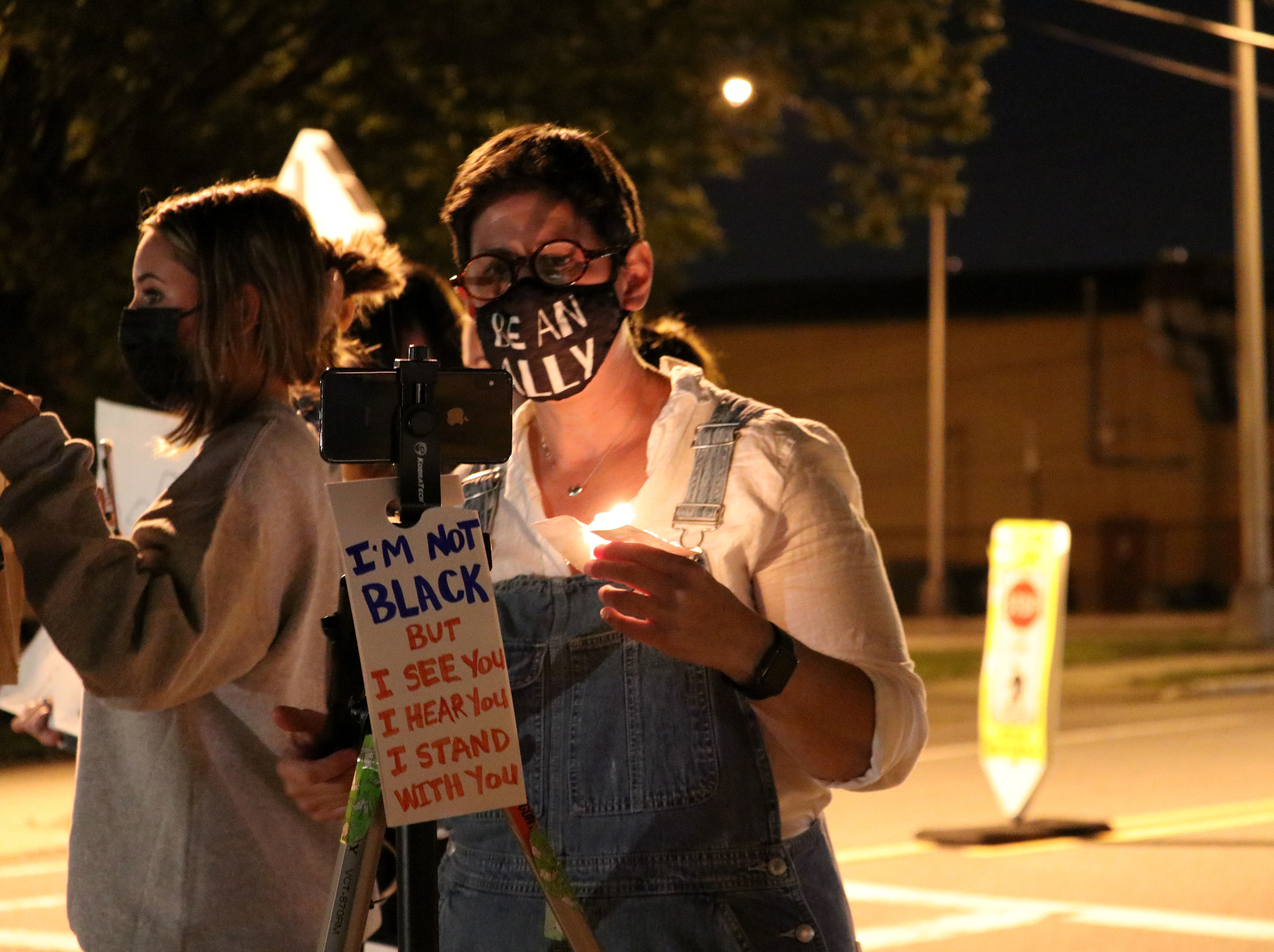 Instagram Coordinator Jennifer Sauer records RASE NJ peacefully protest outside of Ramsey town hall. (Photo/Sunah Choudhry)