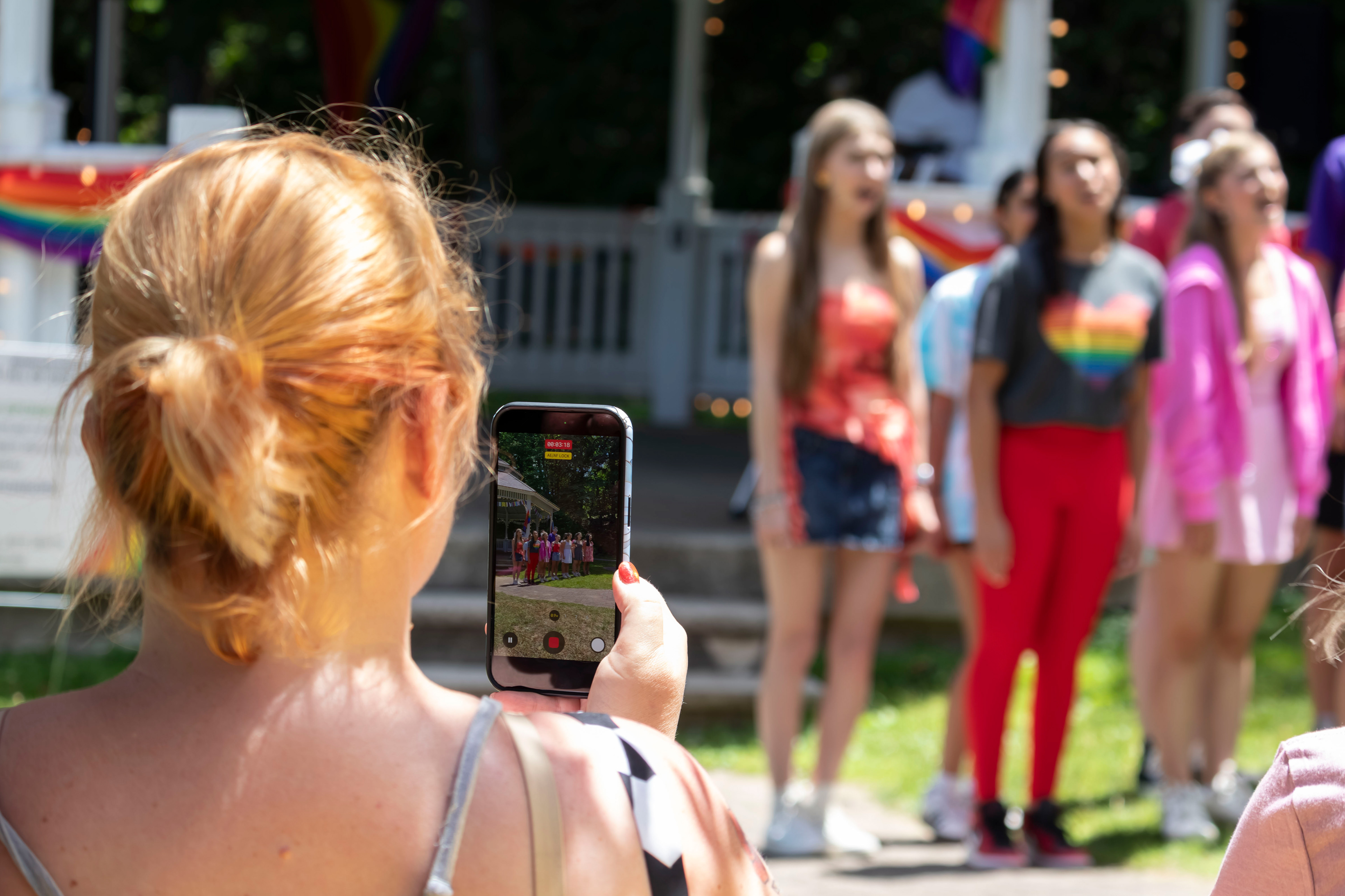 BOONTON, NJ 06/20/2026 BOONTON PRIDE AT GRACE LORD PARK: Co-President and Co-founder of Boonton Pride Lindsey Weisman records a performance by Morristown’s Mayo Performing Arts Company. Boonton residents and visitors gather to celebrate Pride, hear speakers and watch performances by the Mayo Performing Arts Company.