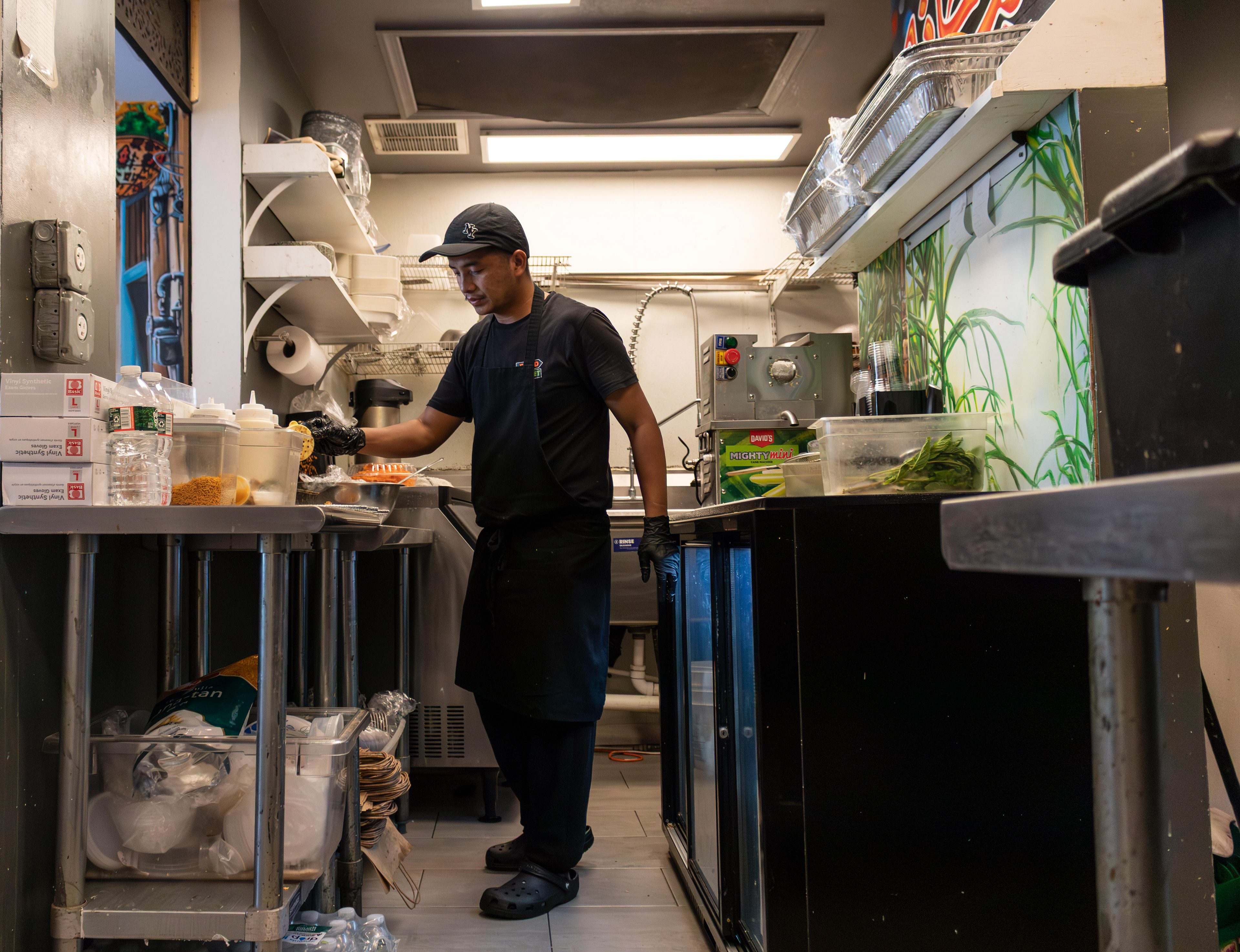 A cook prepares guppa chaat for a to-go order at Food Street in Secaucus. Photo by Sunah Choudhry.