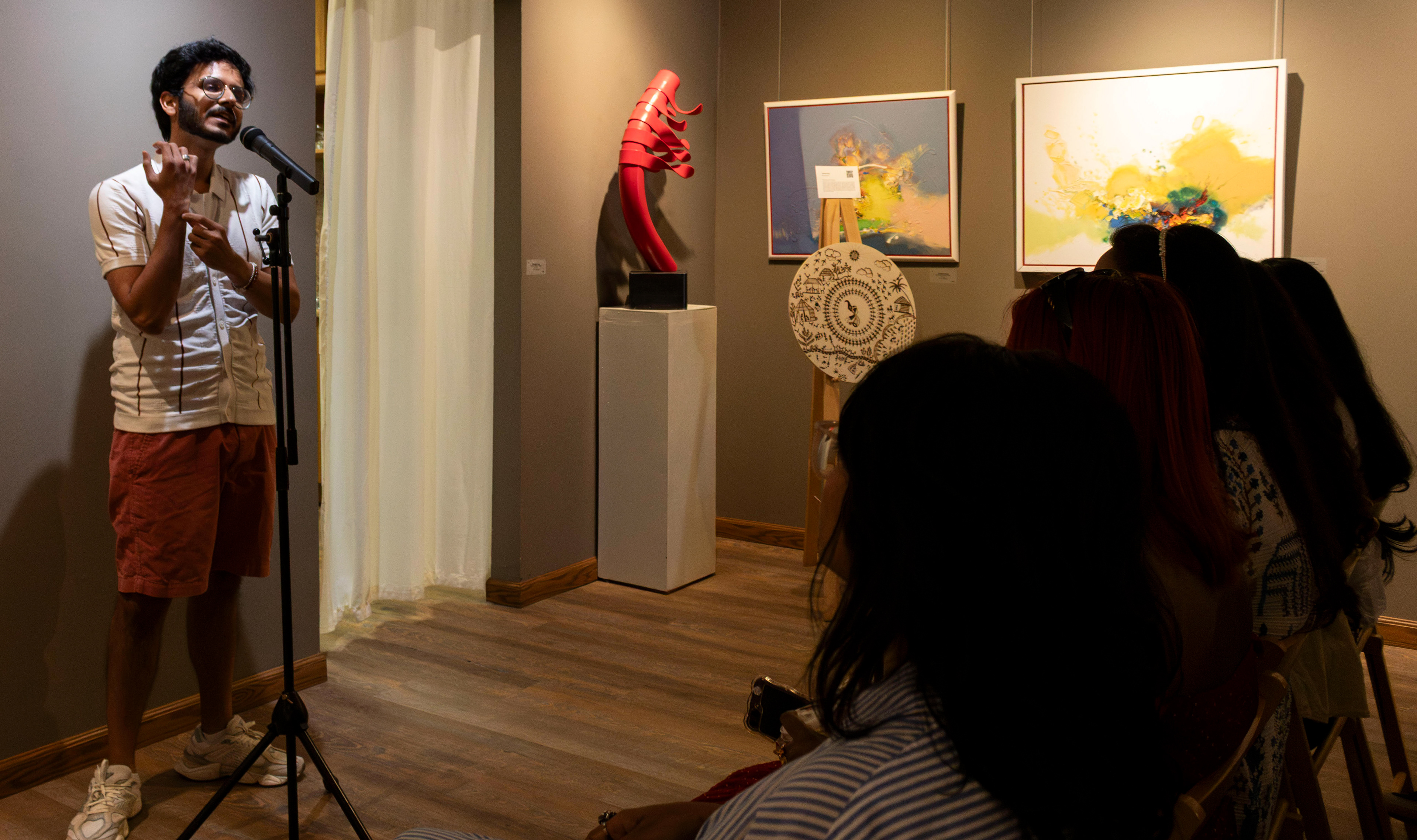 NEW BRUNSWICK, NJ 06/20/2026 CANVAS AND KAHANI: Poet Munsif Husami performs spoken word poetry to the crowd. Central Desi, a South Asian news publication, hosts its first-ever art showcase and open-mic at Alfa Art Gallery on Church Street. Photo by Sunah Choudhry.