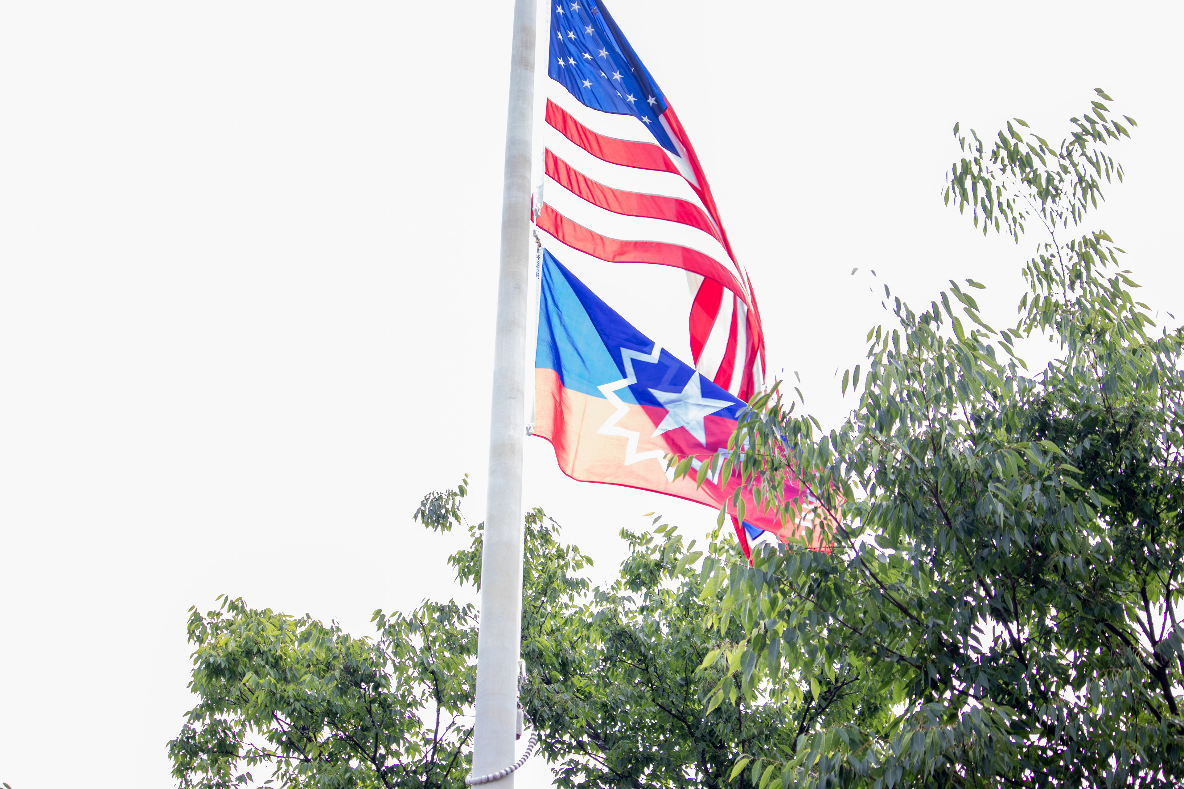 MONTCLAIR, NJ 06/19/2026 JUNETEENTH FLAG RAISING: Montclair’s Juneteenth flag flies high on the corner of Bloomfield Ave and Church Street. Photo by Sunah Choudhry.