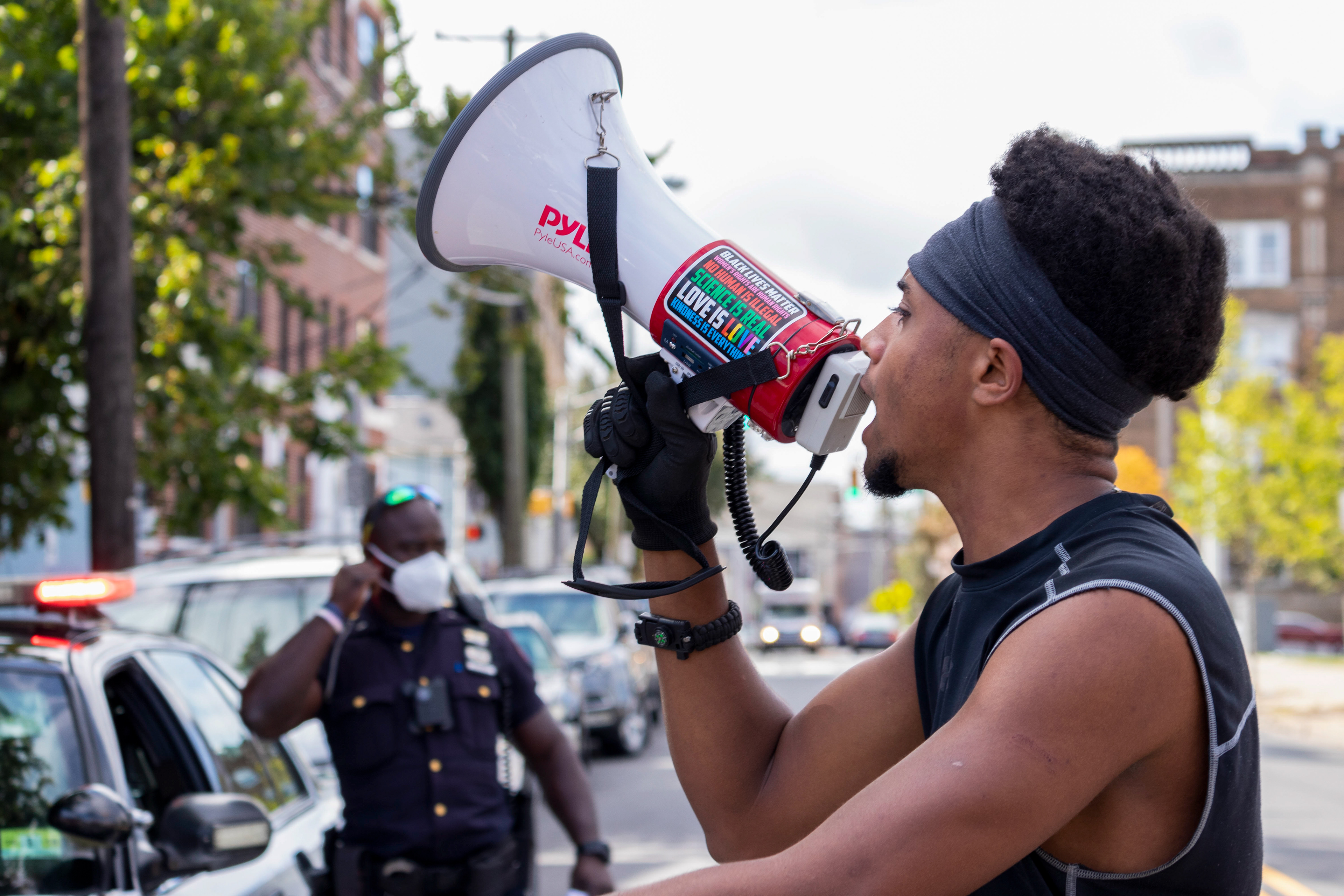 Boaz Matlack chants "Black Lives Matter," while protesting from Audobon Park to Berry Lane Park in Jersey City. (Photo/Sunah Choudhry)