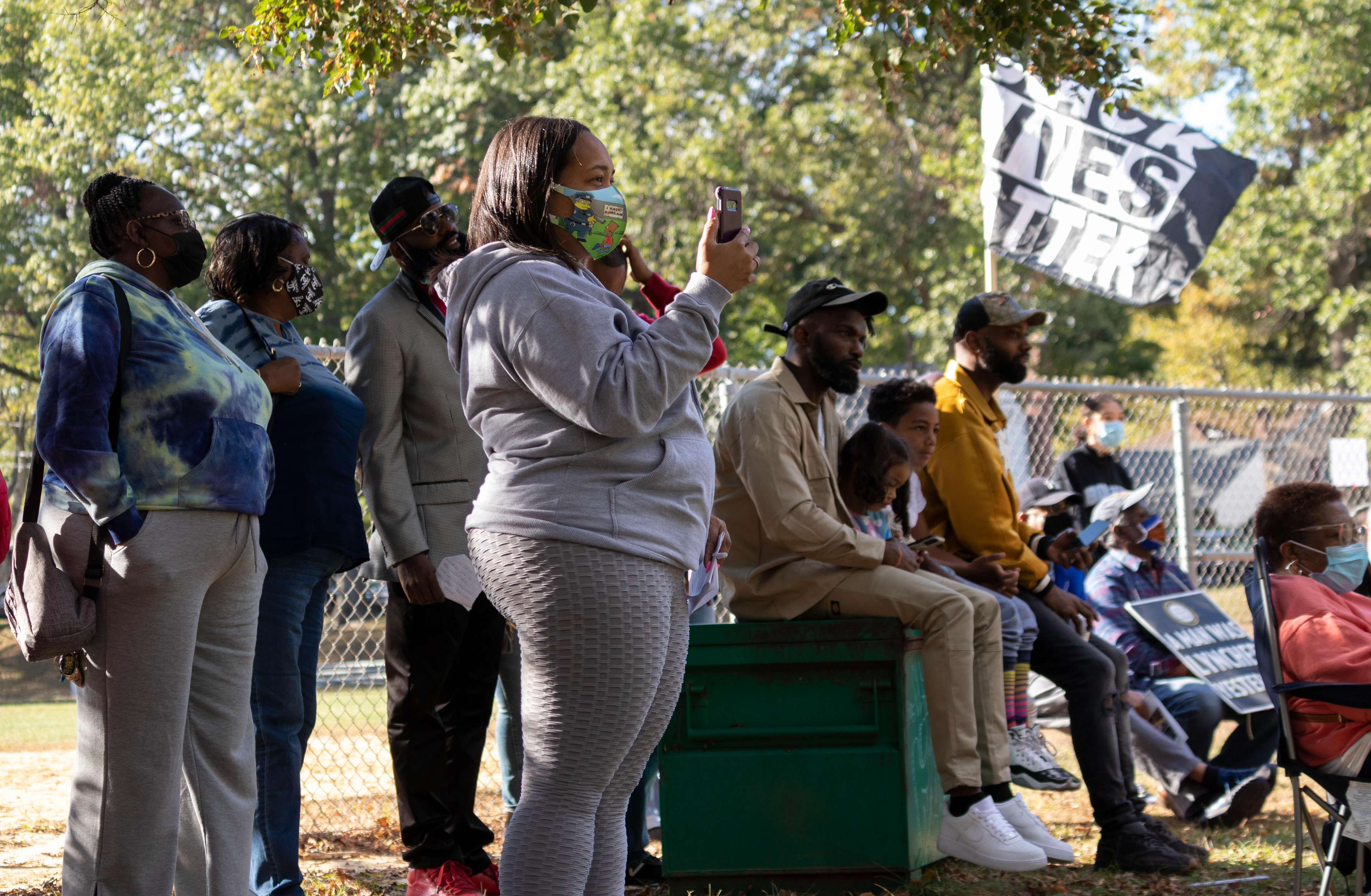 Attendees listen to and take photos of Lawrence Haam at Bernard E. Brooks park in Teaneck on Saturday, October 3rd, 2021. (Photo/Sunah Choudhry)