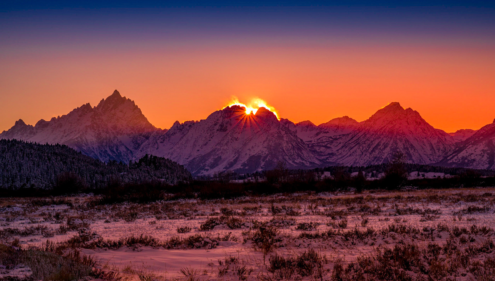 Sun setting behind the Tetons