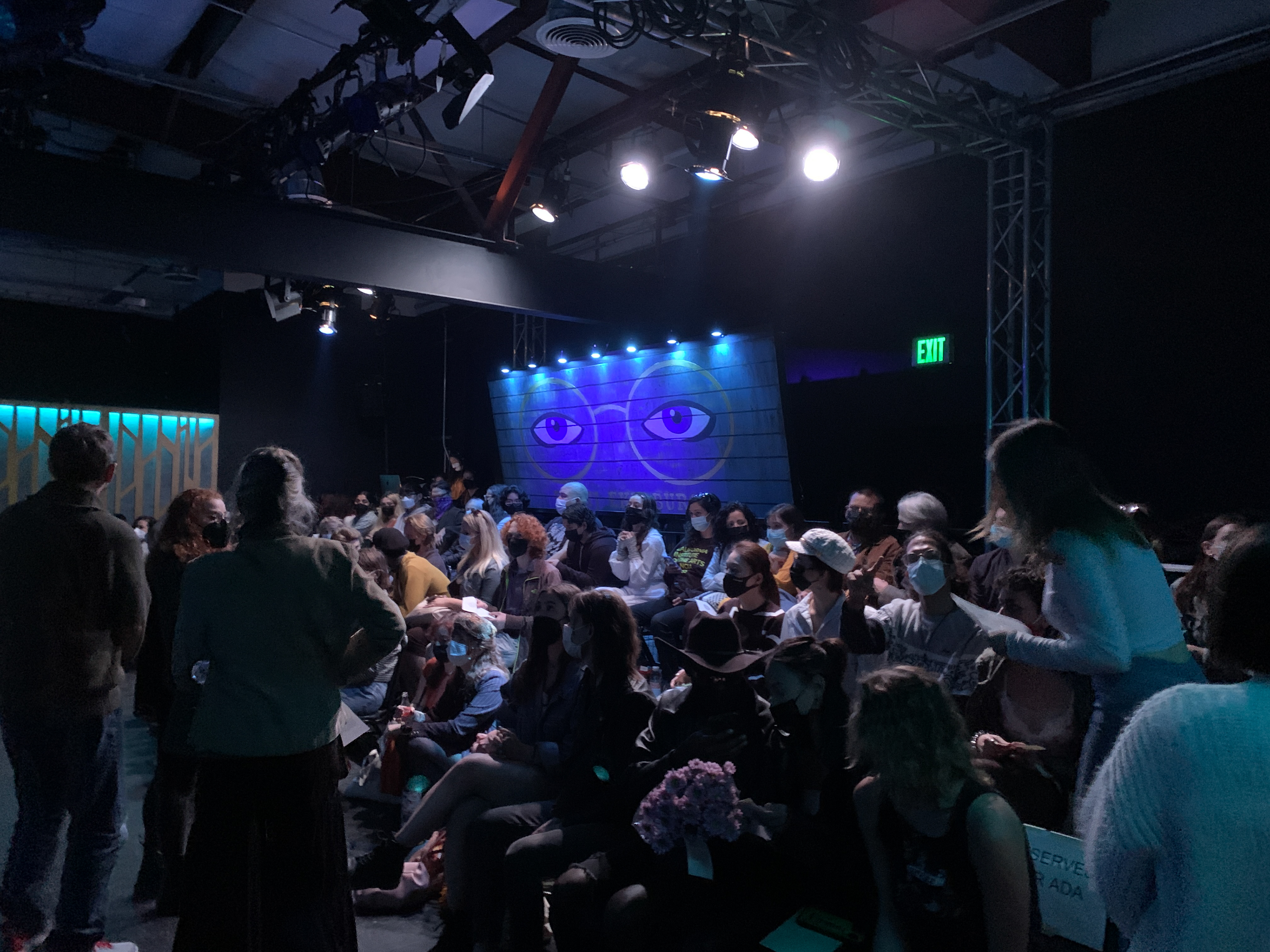 A CROWDED HOUSE AS THE EYES WATCH OVER