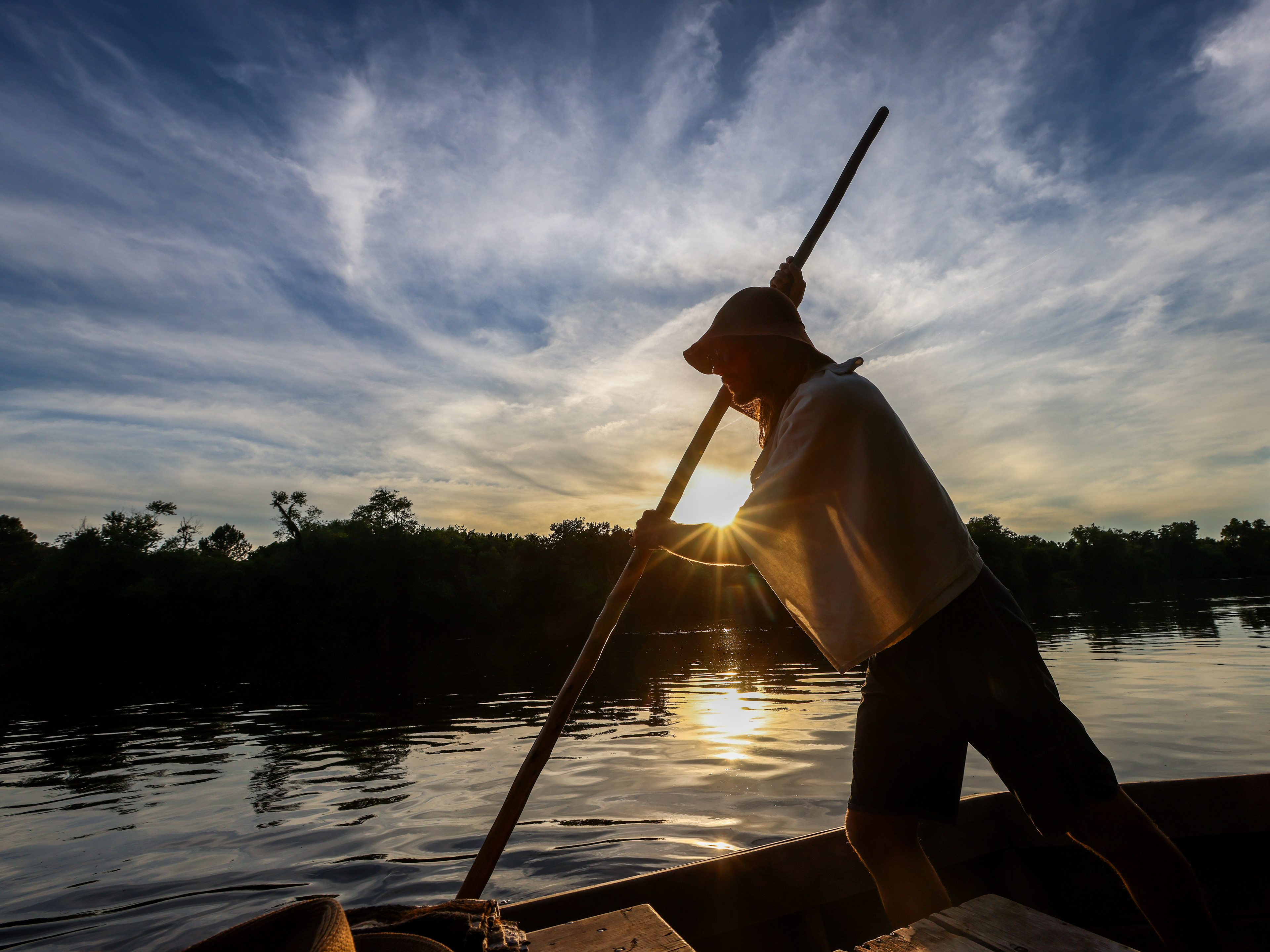 Will Smith uses a pole to propel the batteau forward during the James River Batteau Festival's voyage down the James River on Wednesday, June 19, 2024. Each day, the batteaux cover between 13 and 21 miles, and travel from sunrise to sunset. 