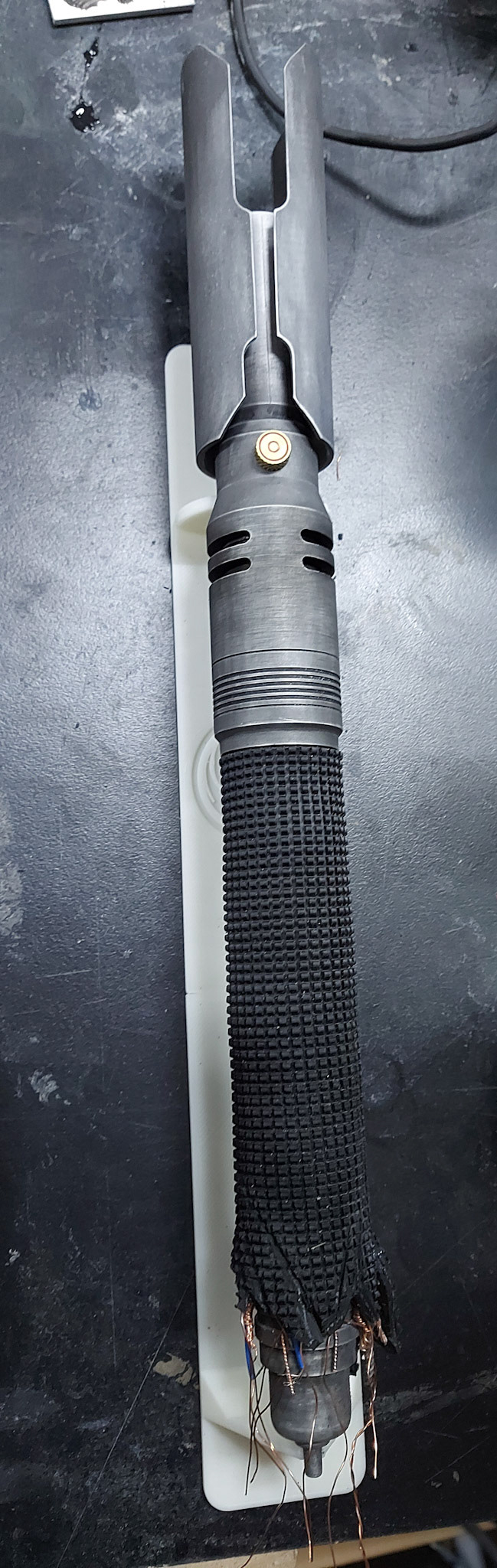 The machined saber was finished with a custom silicone grip to match the one seen in game