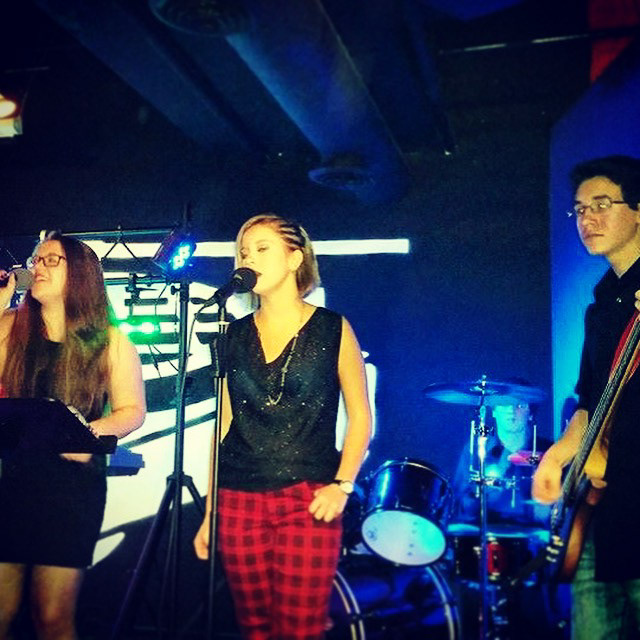 Photo taken of some of my bandmates and I during a performance in Jan 2015.
