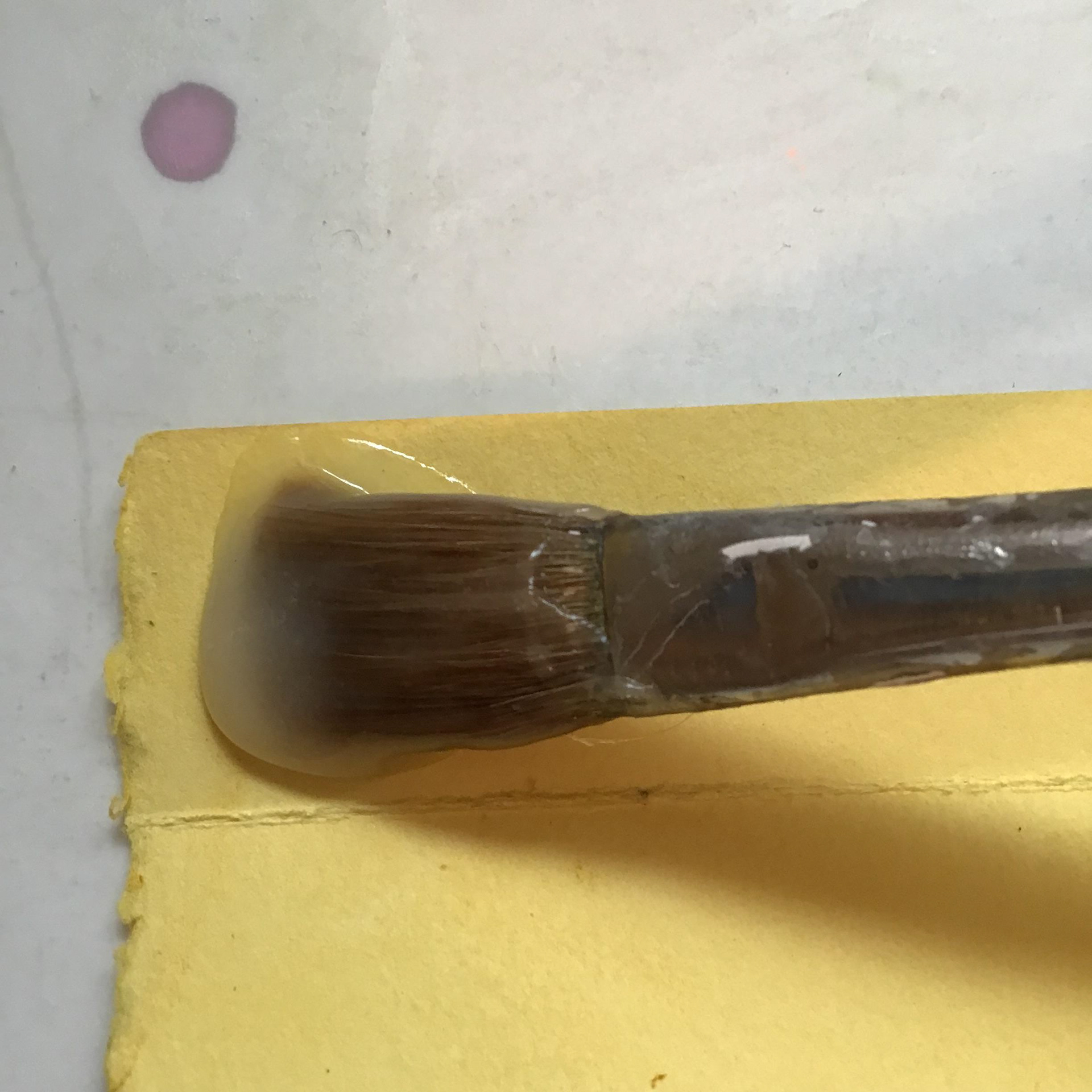 Brush a coat of glue unto the hinges and glue individual pages to each side...