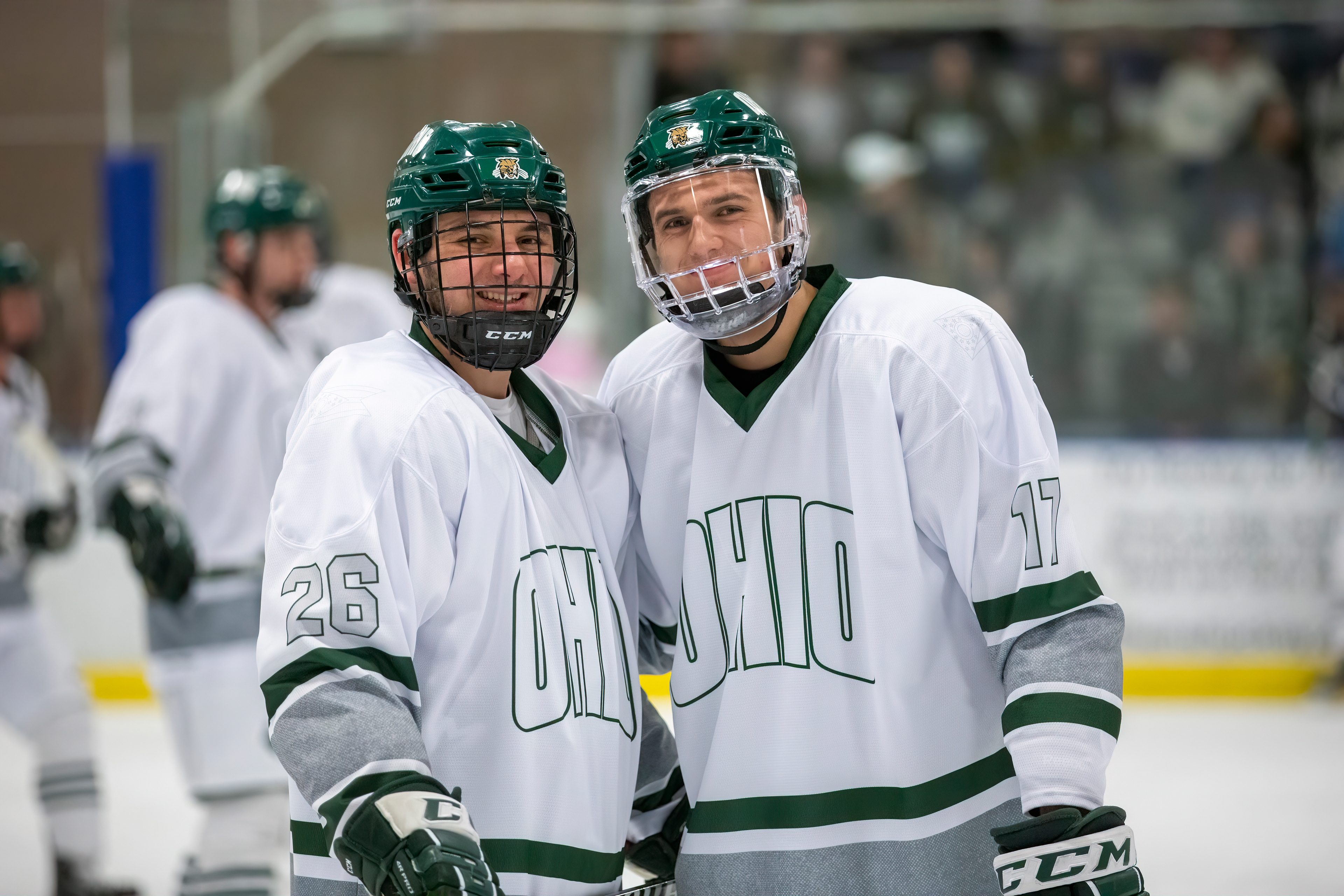 Patrick Roach (#26, left) smiles at the camera with Blake Rossi (#17, right).