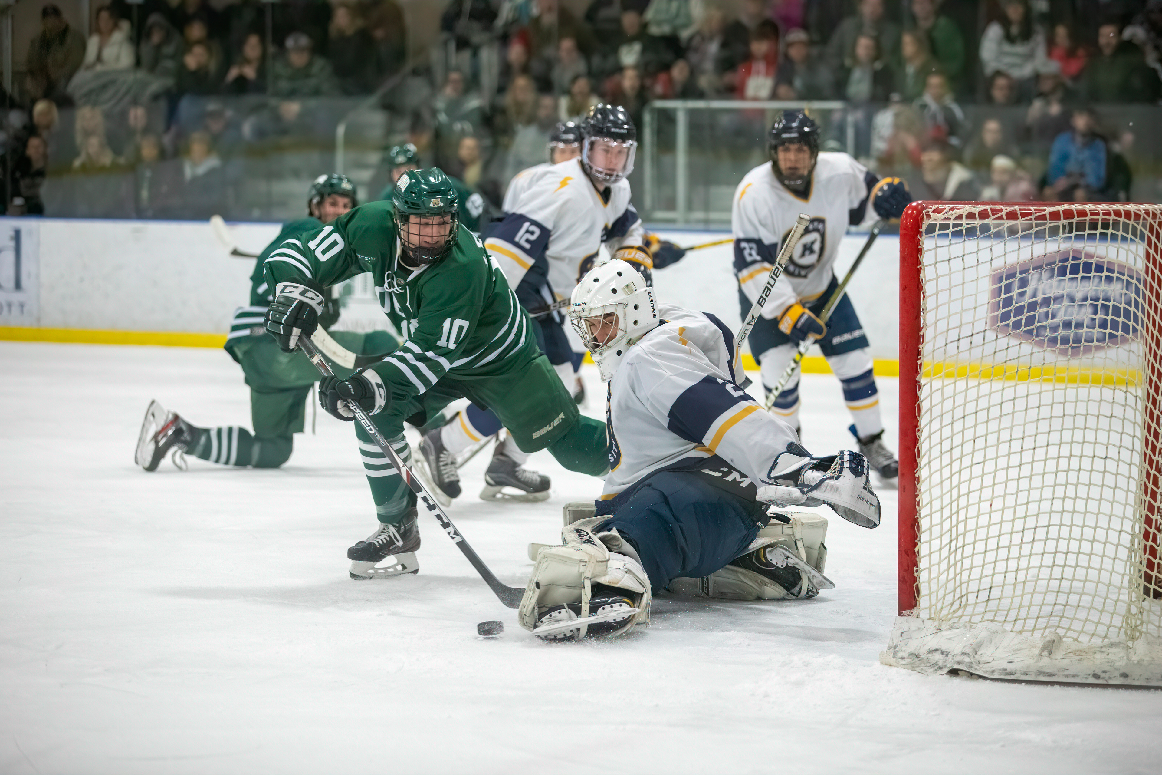 Ryan Leonard (#10) is denied by the Kent State goalie, as Bobcats and Golden Flashes look on.