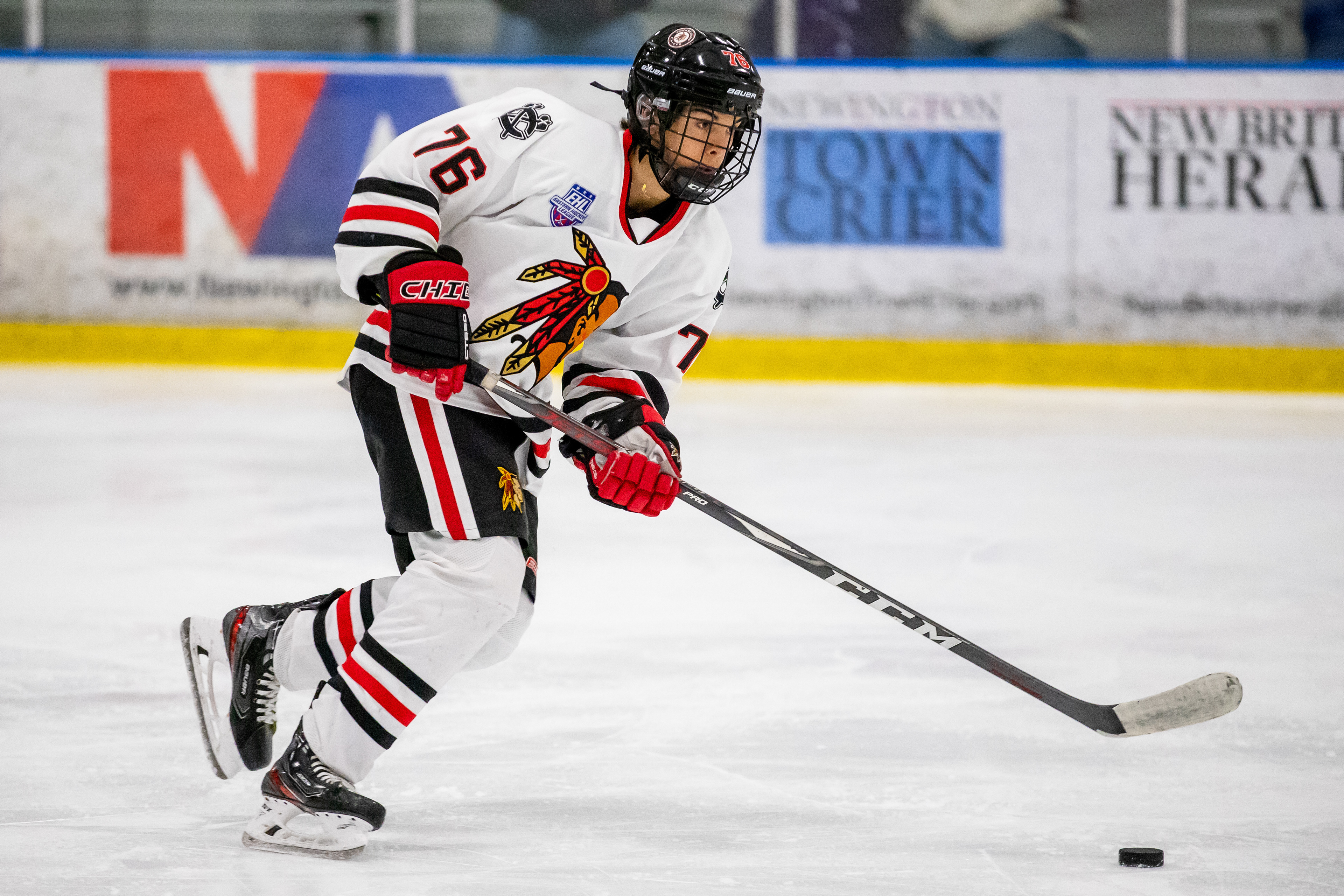 Sahrane Zinger carries the puck up-ice.