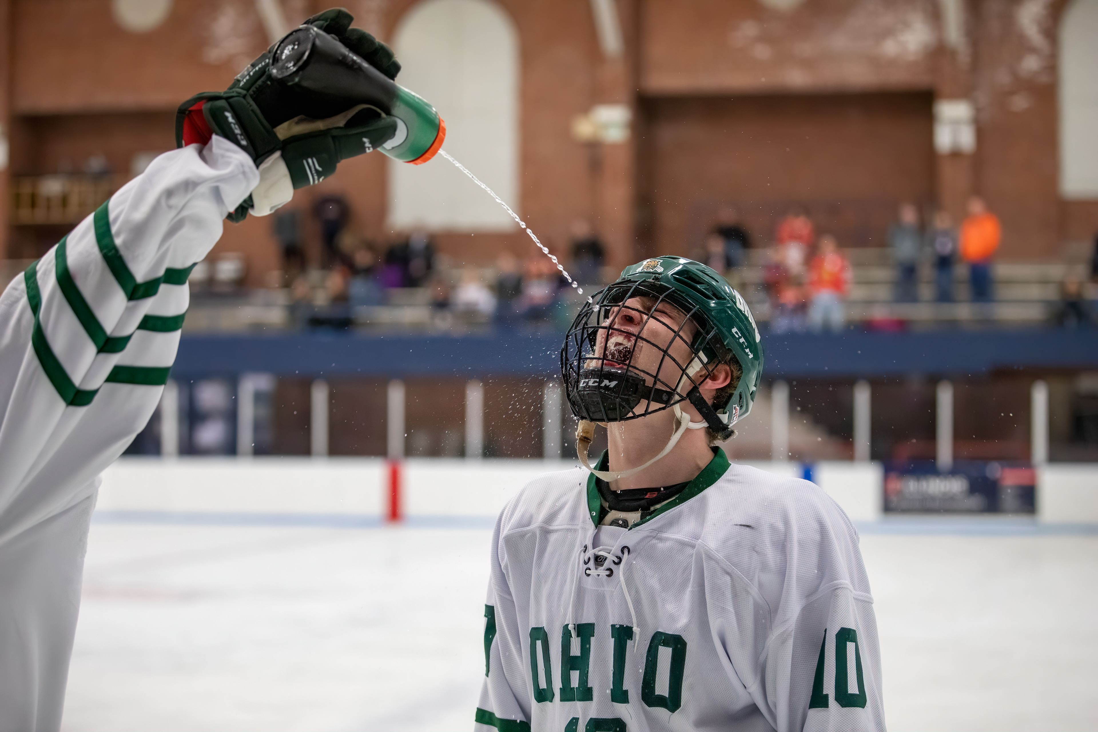 Ryan Leonard (#10) goes through a pre-game ritual with Patrick Roach (out of frame).